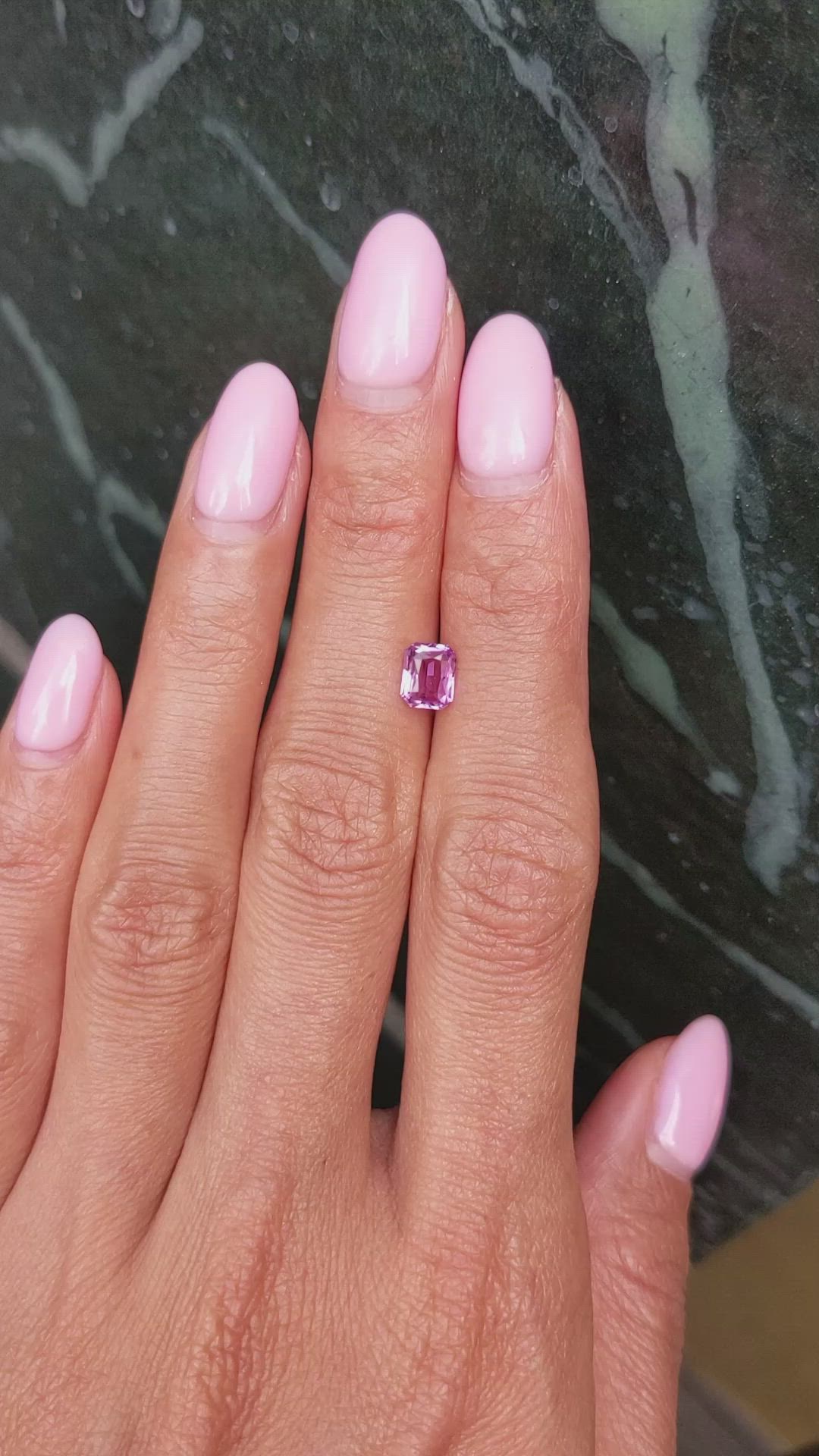 0.94 Ct. Purplish Pink Sapphire from Madagascar Size Video