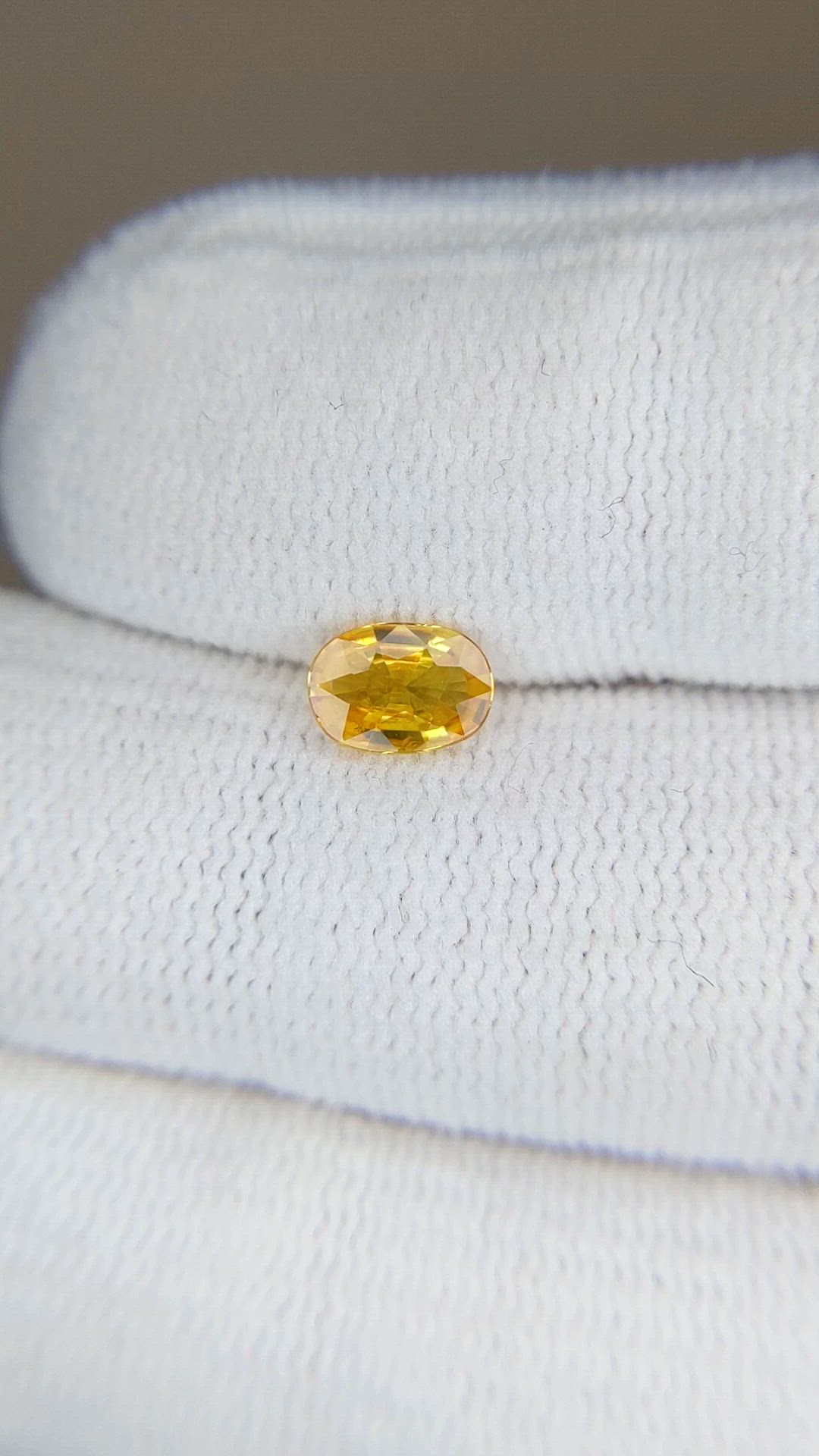 0.60 Ct. Orangish Yellow Sapphire from Thailand Size Video