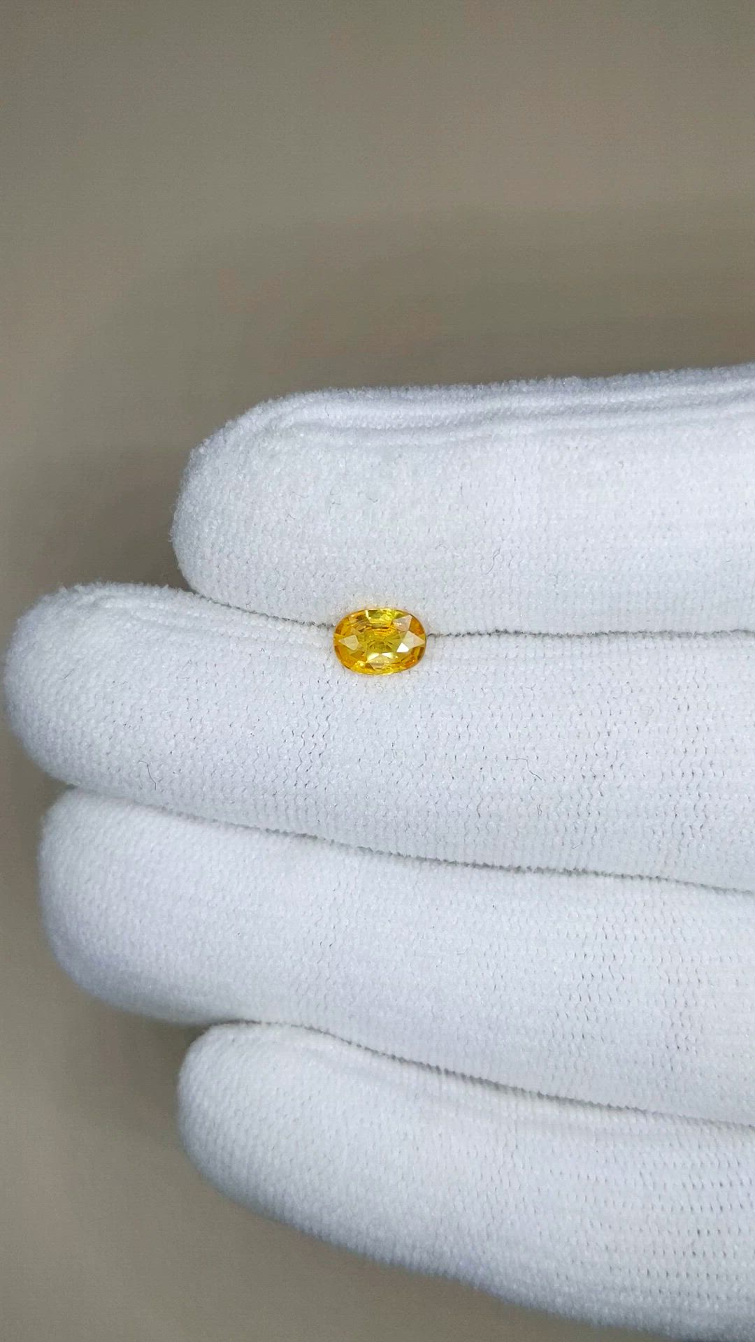 0.60 Ct. Orangish Yellow Sapphire from Thailand Size Video