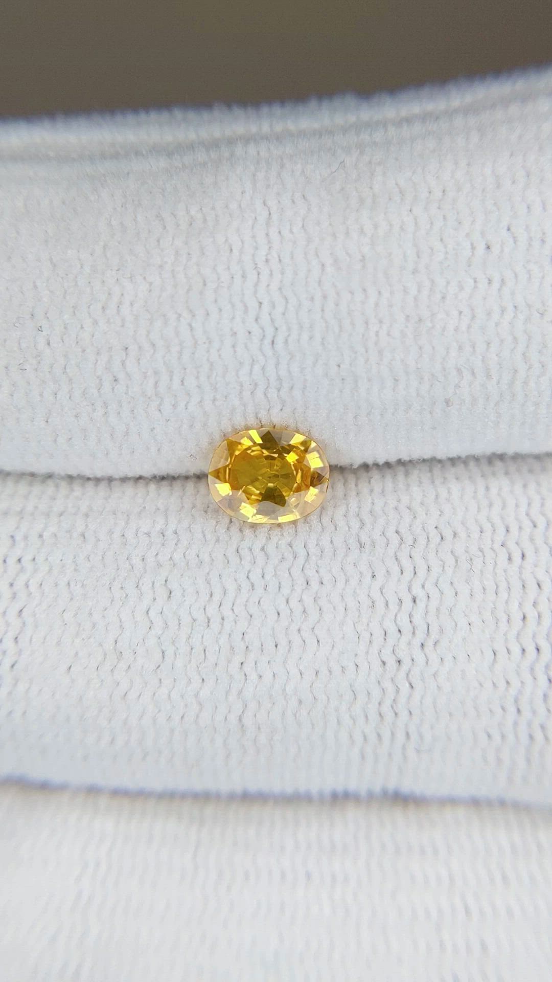 0.65 Ct. Orangish Yellow Sapphire from Thailand Size Video
