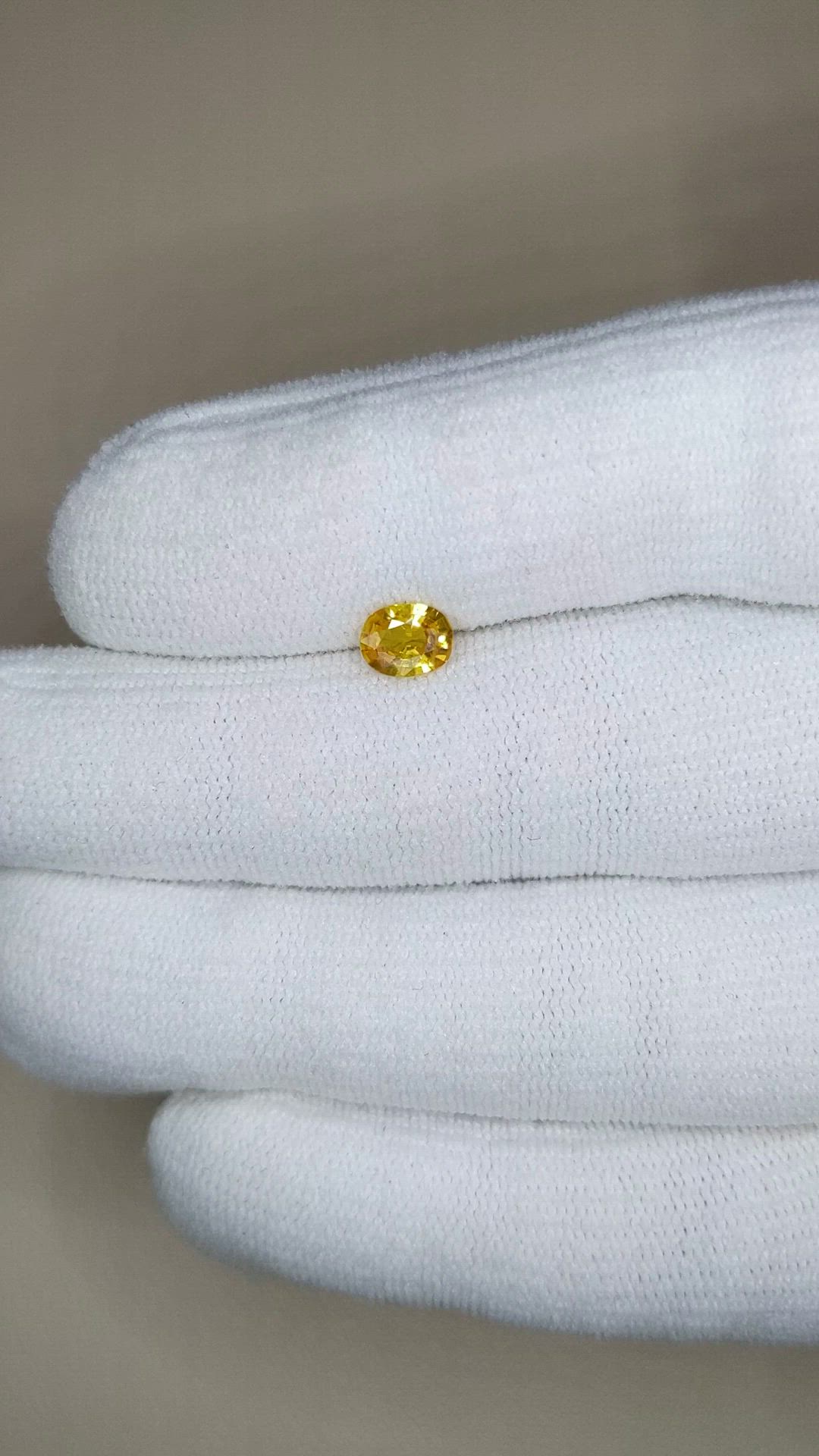 0.65 Ct. Orangish Yellow Sapphire from Thailand Size Video