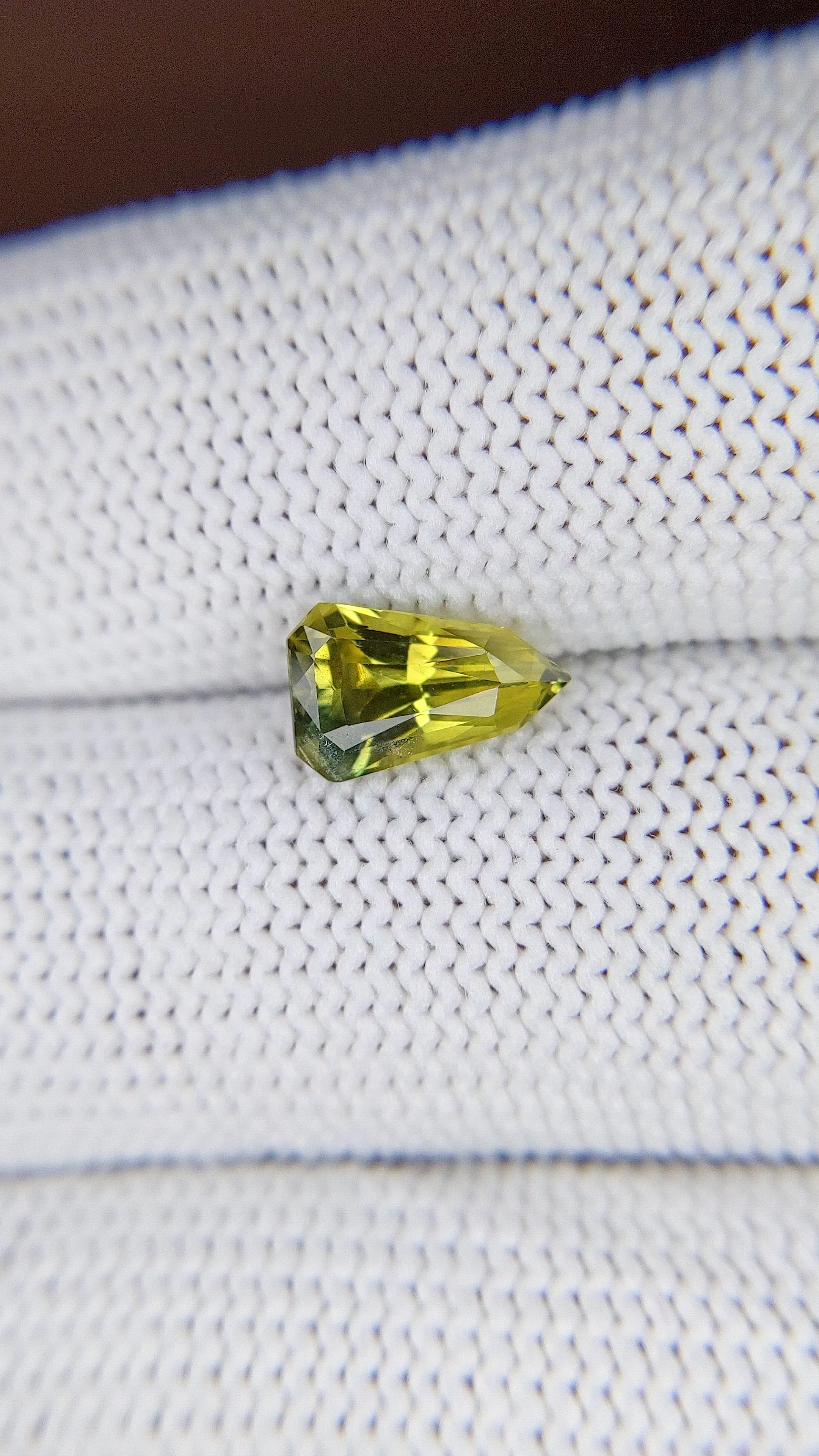 1.63 Ct. Greenish Yellow Sapphire from Madagascar Size Video