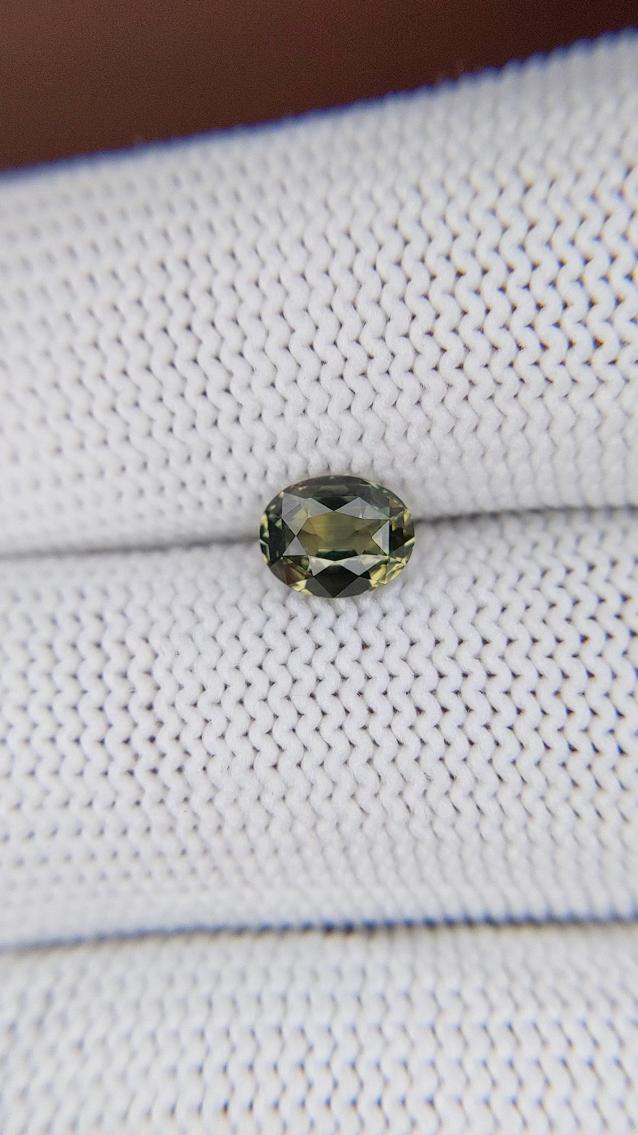 0.88 Ct. Yellowish Green Sapphire from Tanzania Size Video
