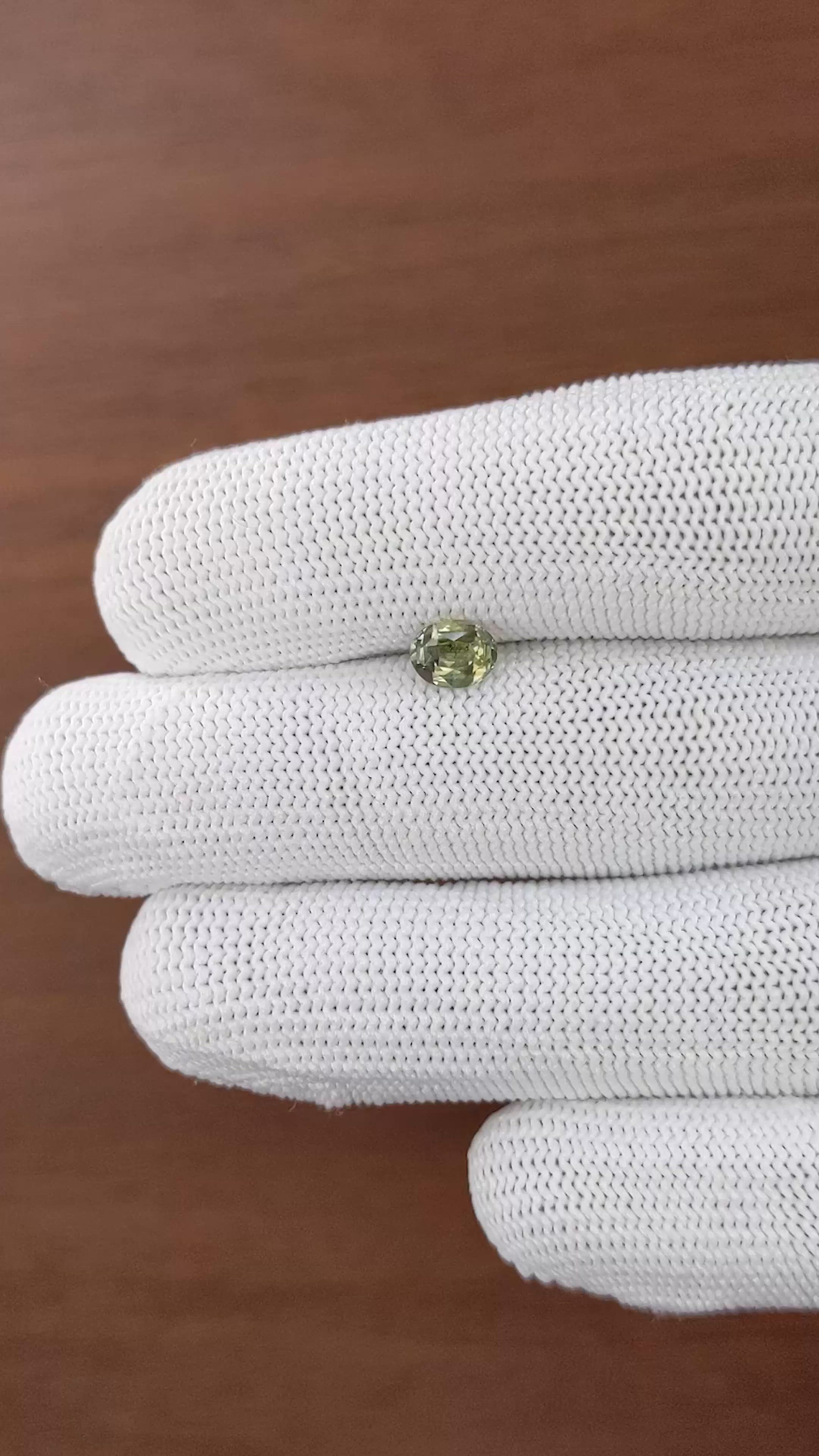 0.87 Ct. Yellowish Green Sapphire from Tanzania Size Video