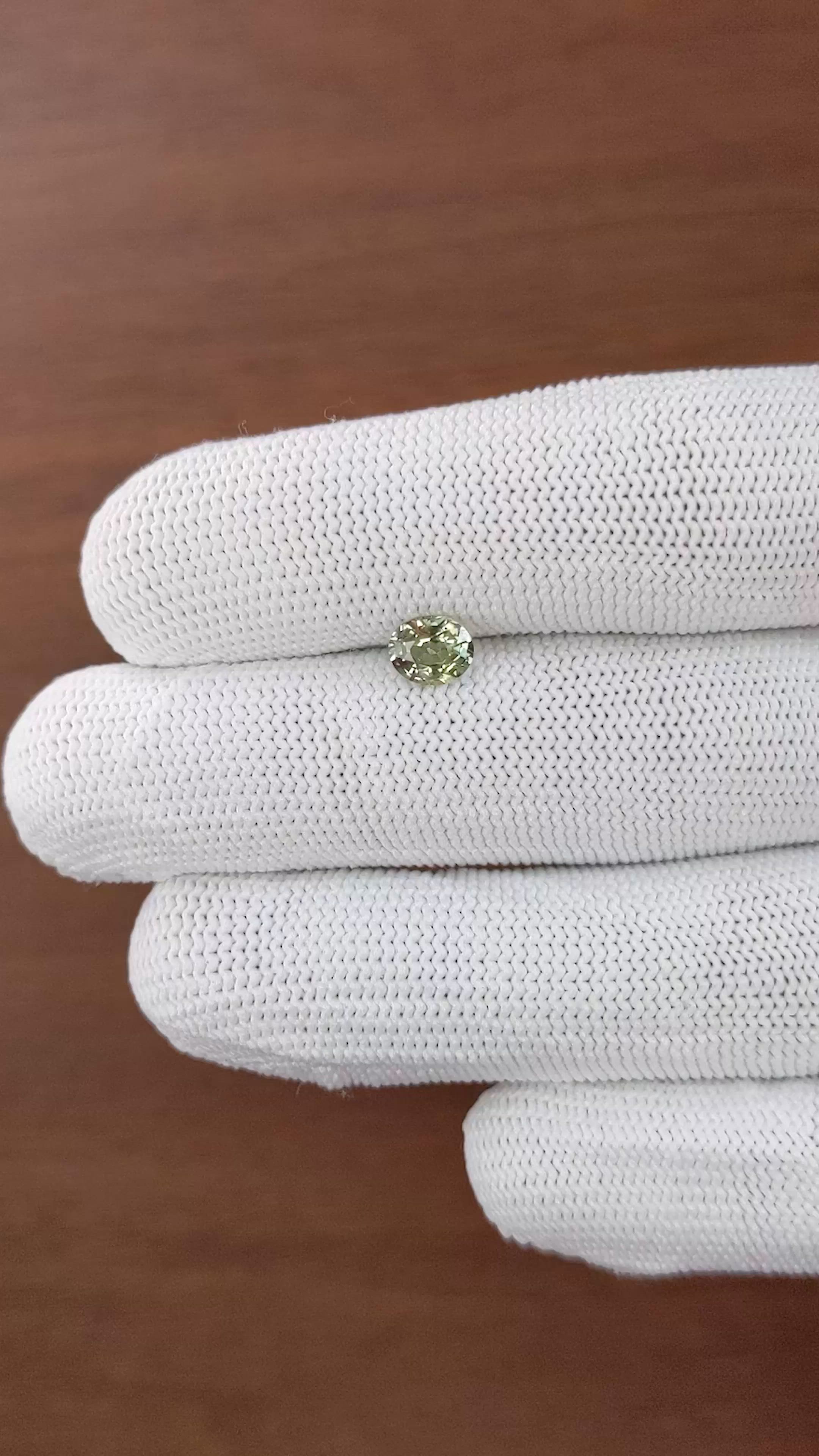0.92 Ct. Yellowish Green Sapphire from Tanzania Size Video
