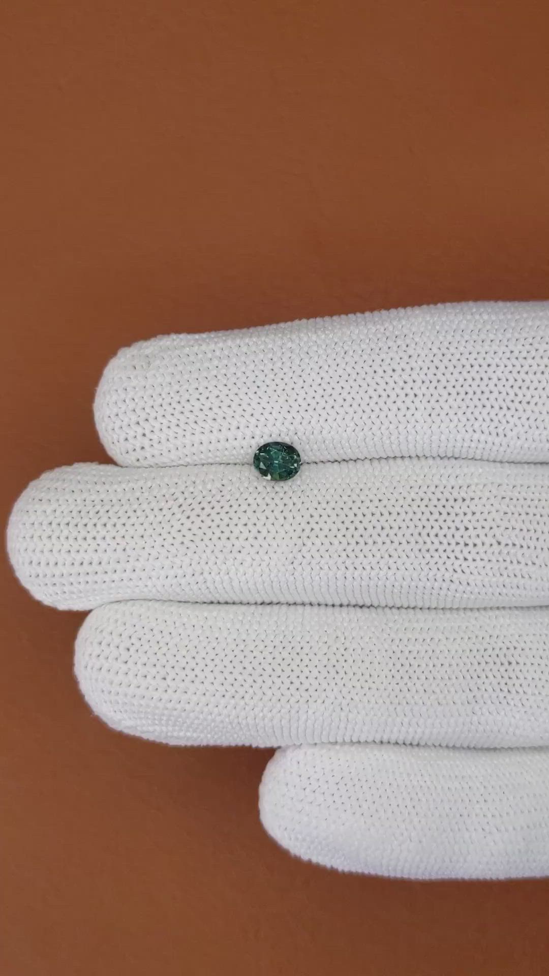0.72 Ct. Bluish Green Sapphire from Madagascar Size Video