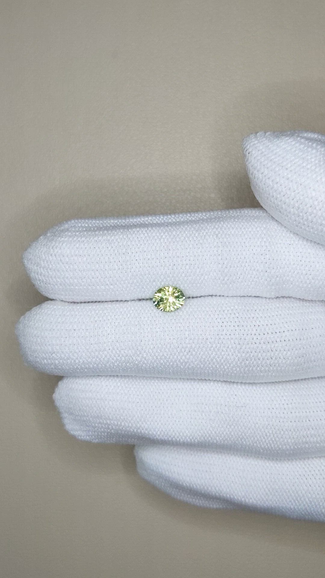 0.79 Ct. Yellowish Green Sapphire from Montana Size Video