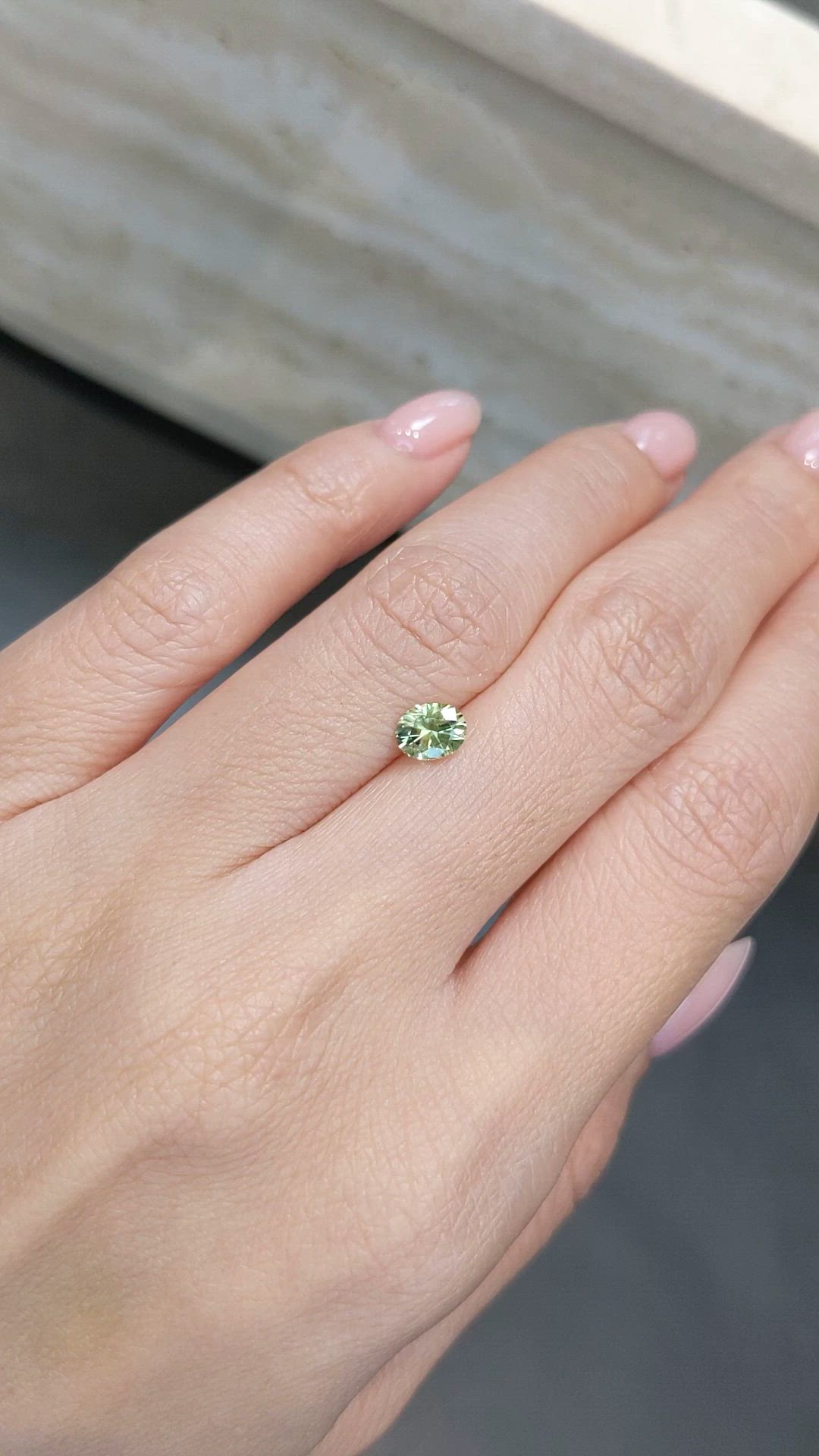 0.79 Ct. Yellowish Green Sapphire from Montana Size Video