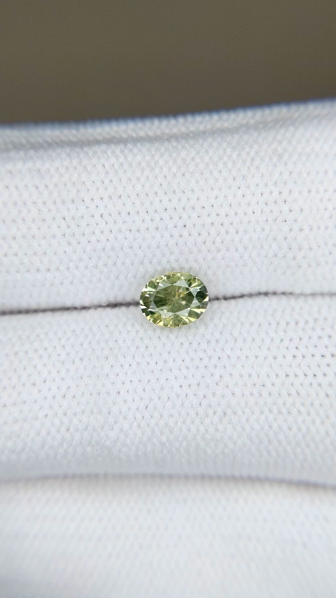 0.79 Ct. Yellowish Green Sapphire from Montana Size Video