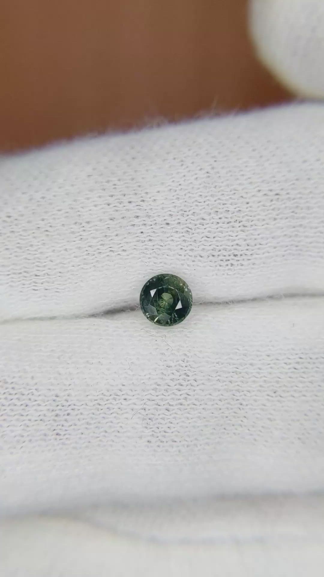 0.56 Ct. Bluish Green Sapphire from Madagascar Size Video