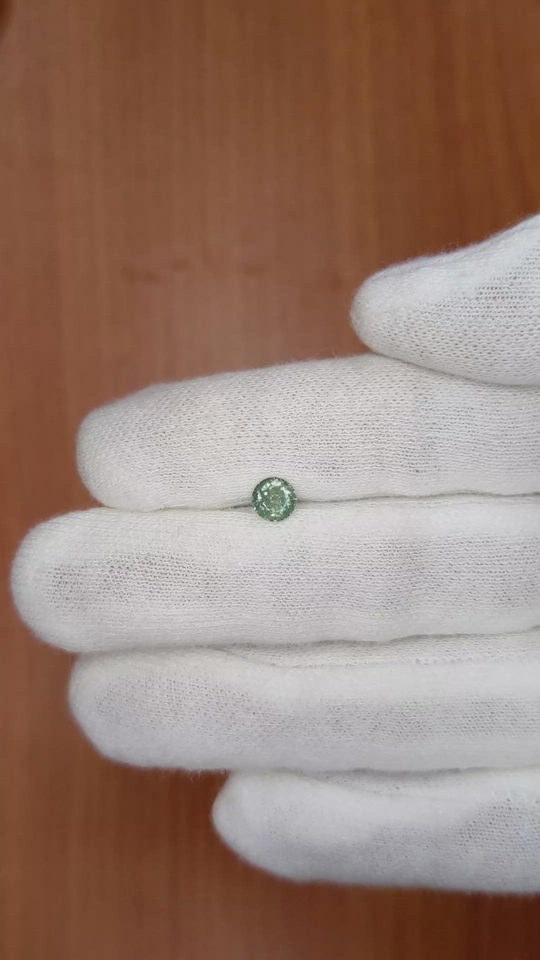 0.58 Ct. Bluish Green Sapphire from Madagascar Size Video