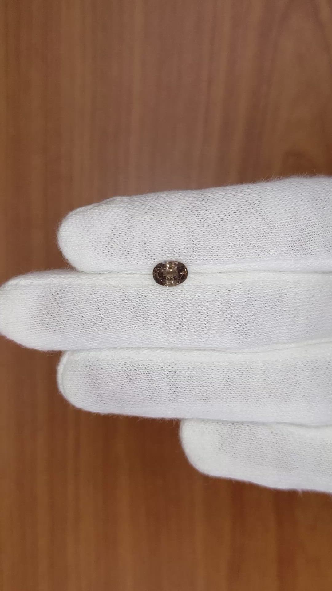 0.91 Ct. Greenish Brown Sapphire from Madagascar Size Video