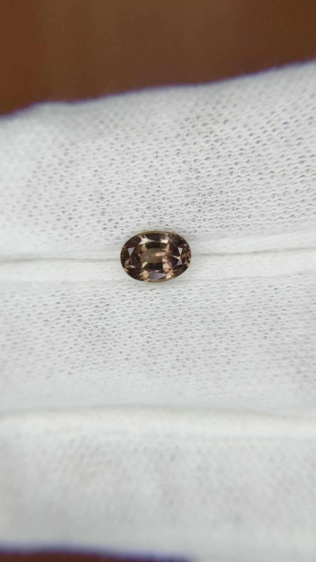 0.91 Ct. Greenish Brown Sapphire from Madagascar Size Video