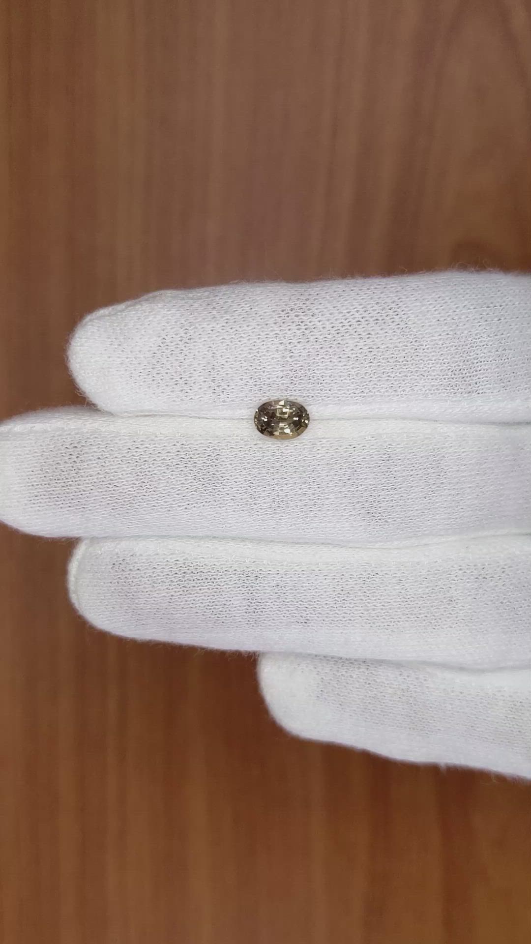 0.73 Ct. Greenish Brown Sapphire from Madagascar Size Video