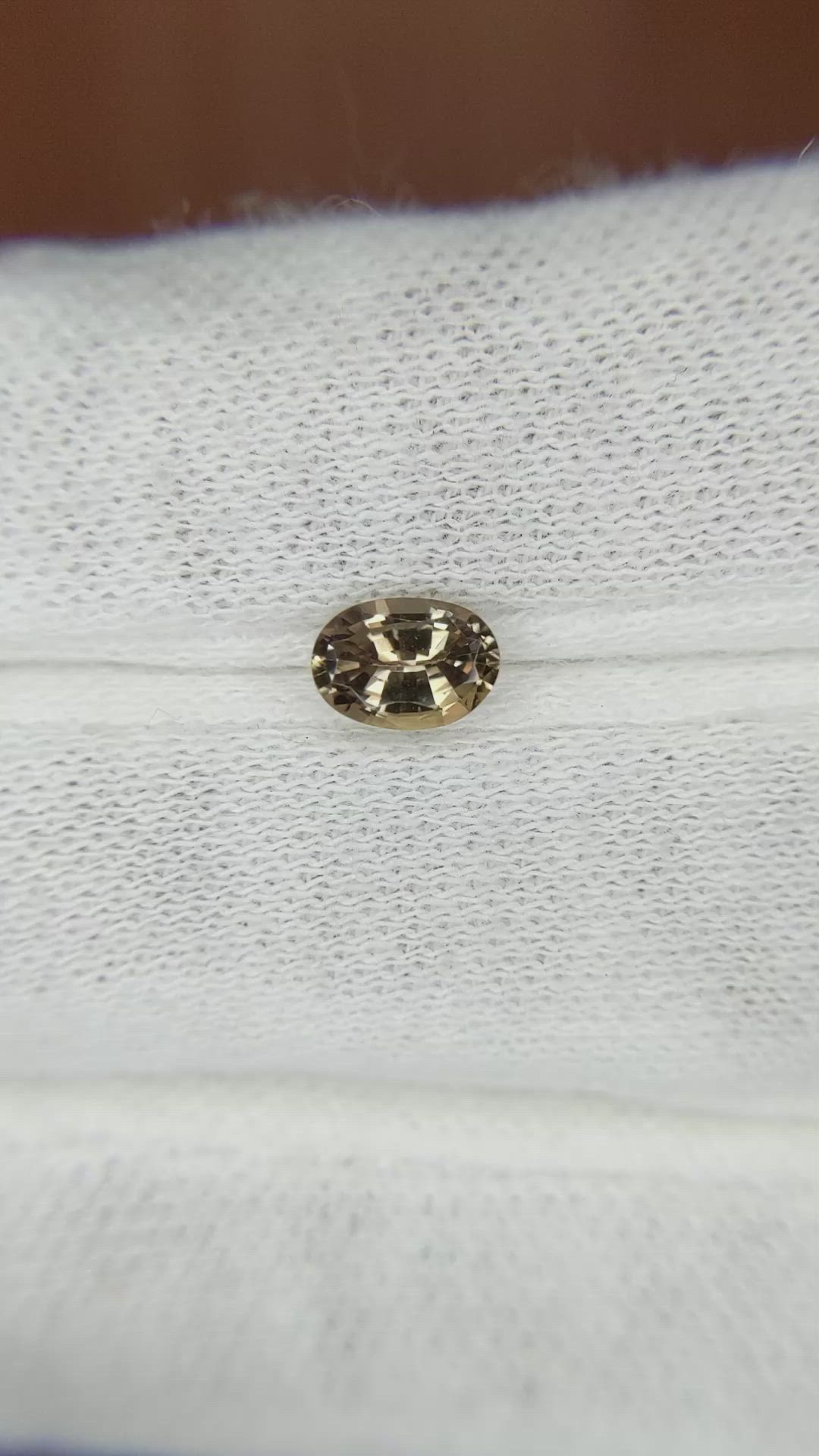 0.73 Ct. Greenish Brown Sapphire from Madagascar Size Video