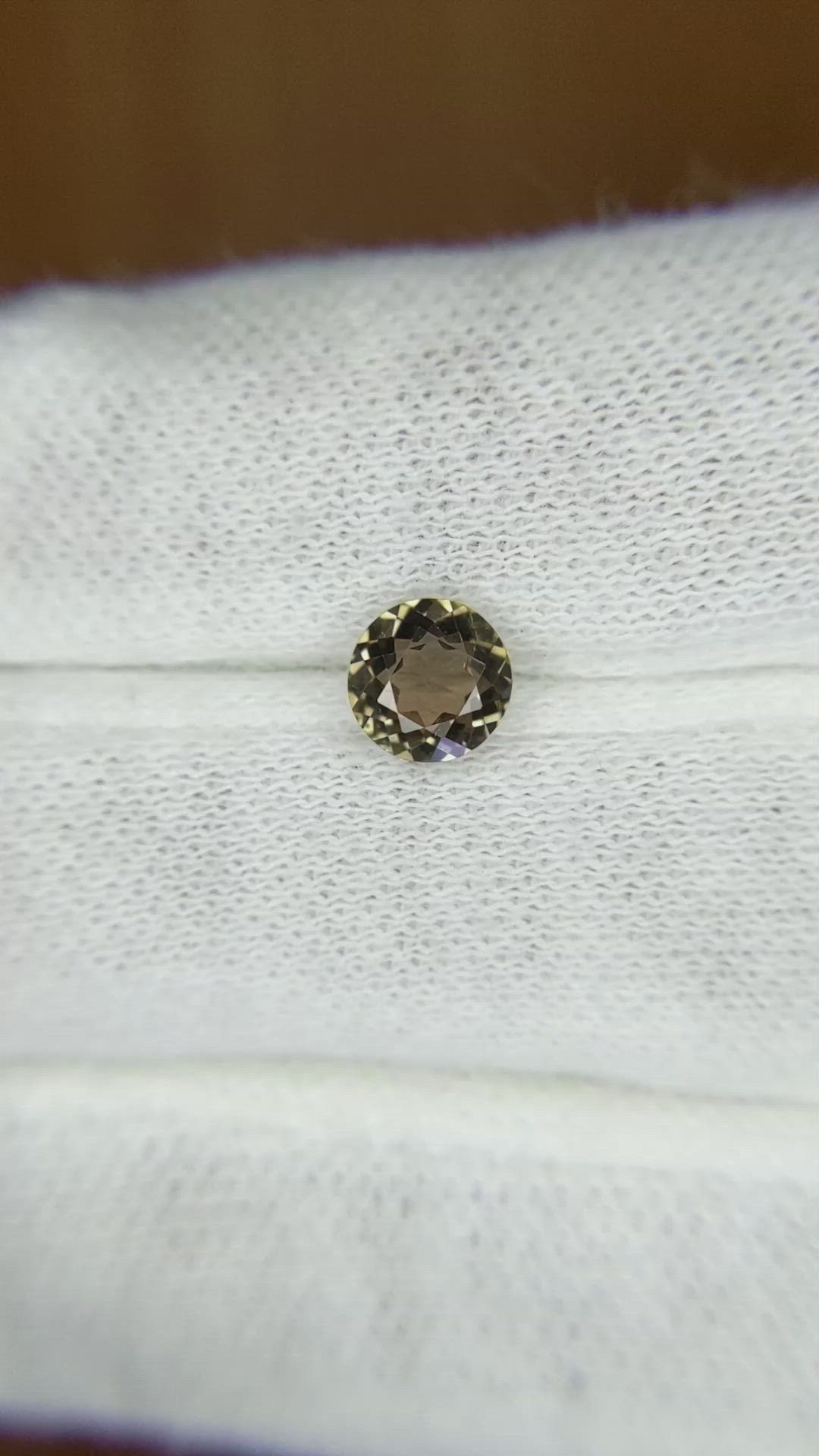 0.84 Ct. Greenish Brown Sapphire from Madagascar Size Video