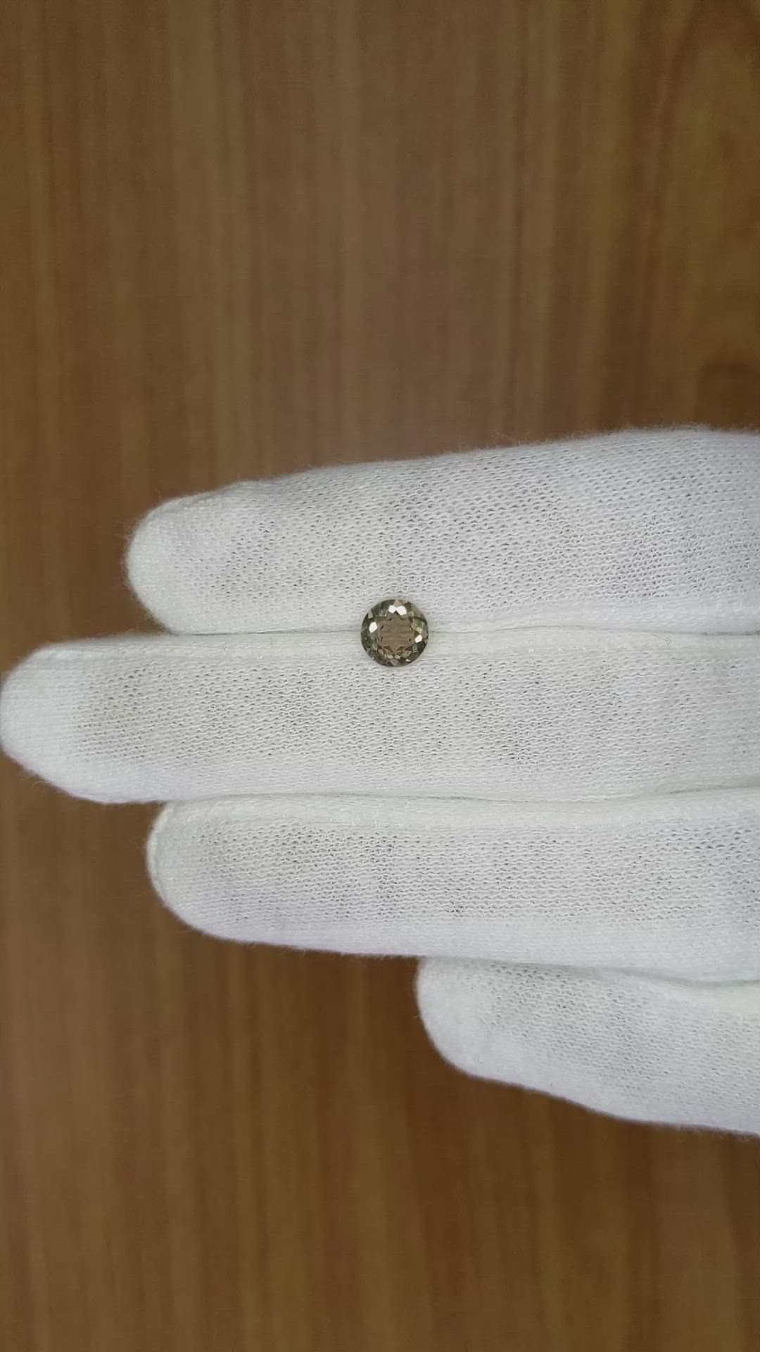 0.84 Ct. Greenish Brown Sapphire from Madagascar Size Video