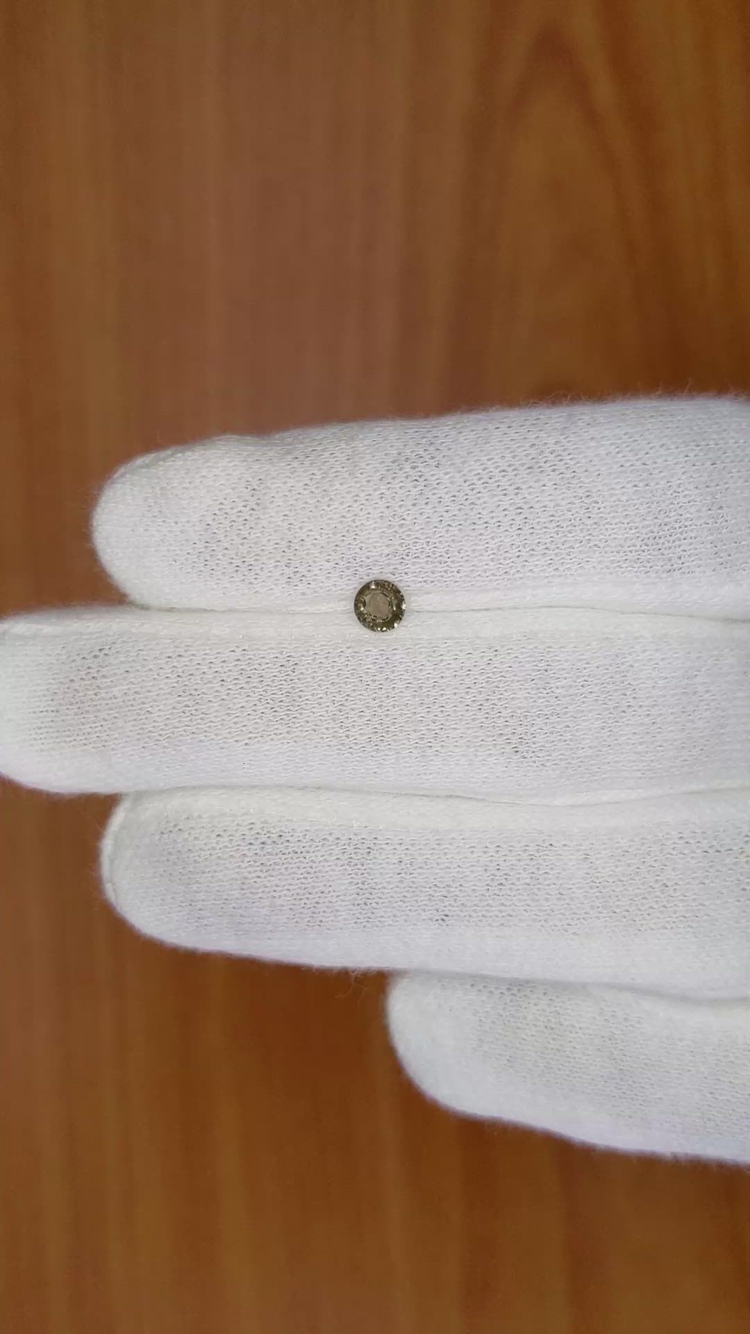 0.32 Ct. Greenish Brown Sapphire from Madagascar Size Video