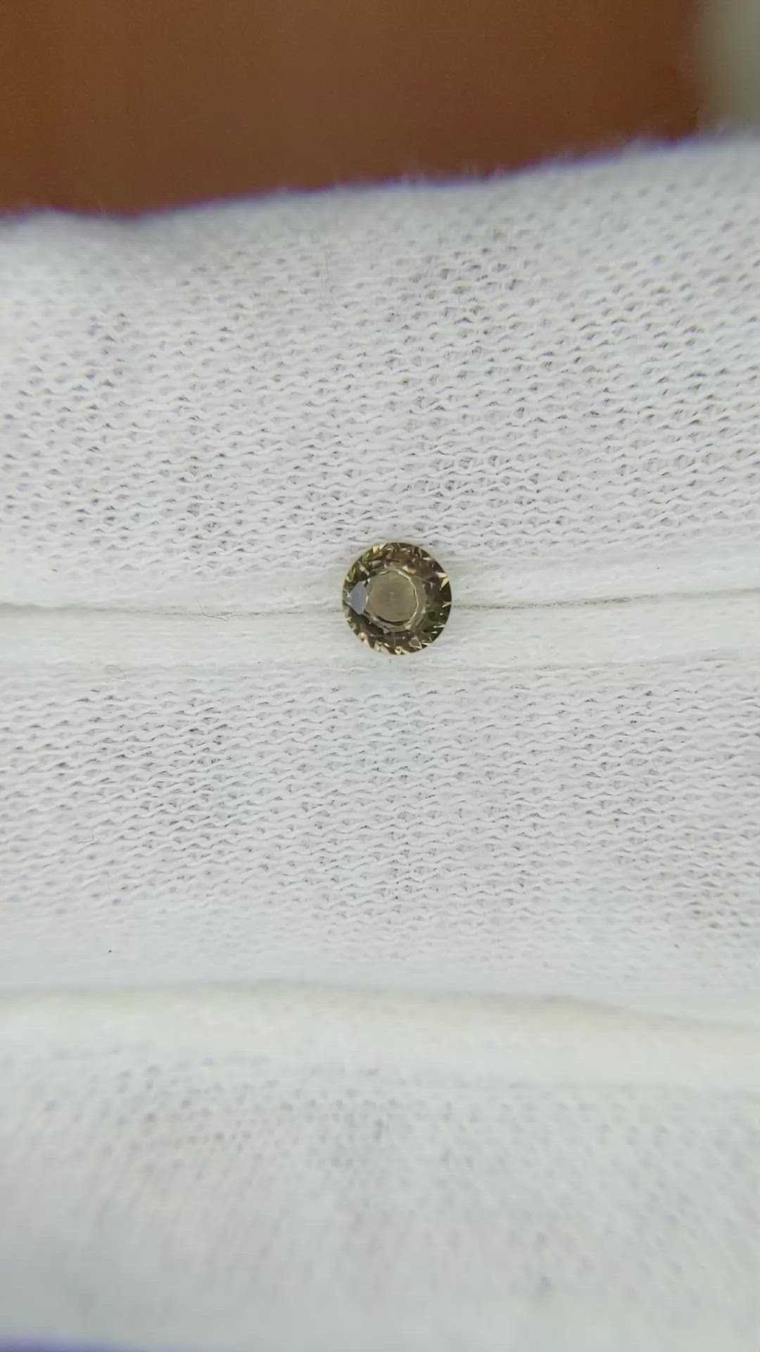 0.32 Ct. Greenish Brown Sapphire from Madagascar Size Video