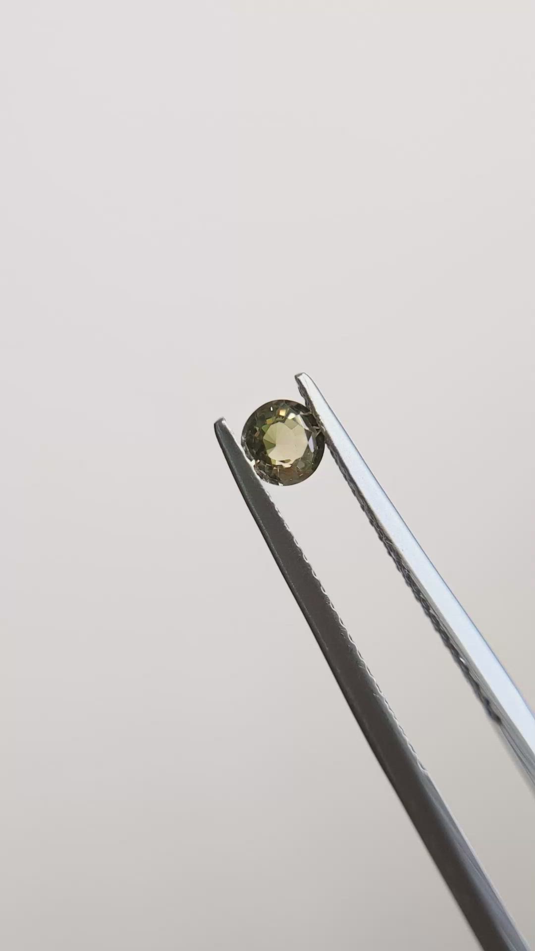 0.32 Ct. Greenish Brown Sapphire from Madagascar Size Video