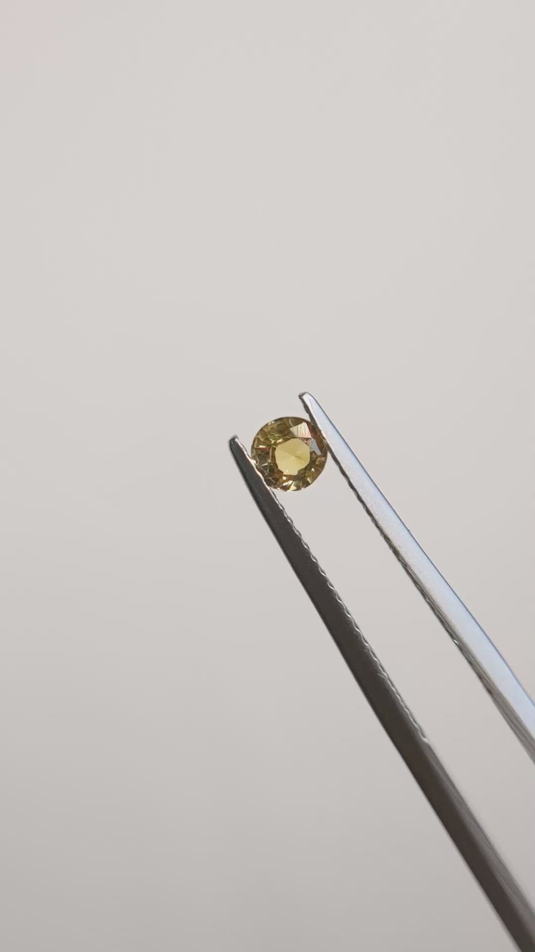 0.37 Ct. Greenish Brown Sapphire from Madagascar Size Video