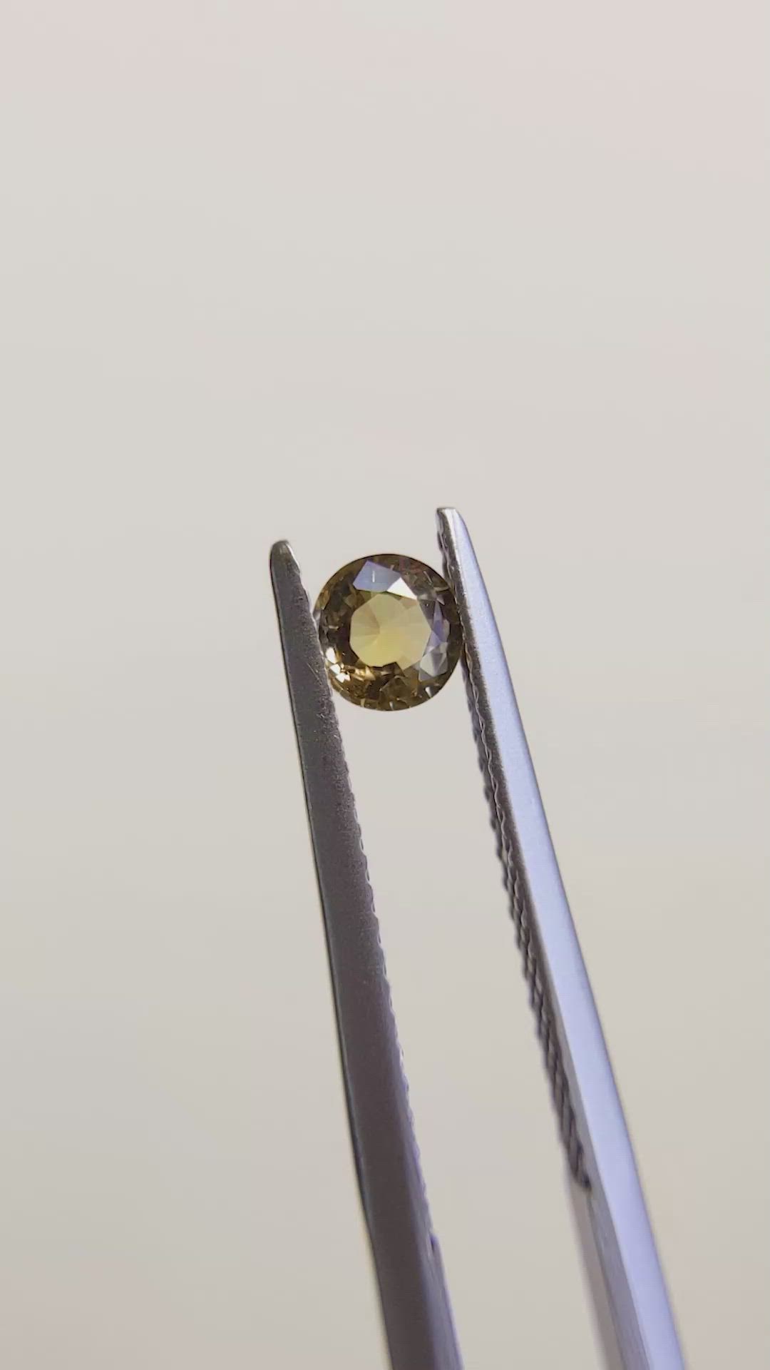 0.39 Ct. Greenish Brown Sapphire from Madagascar Size Video