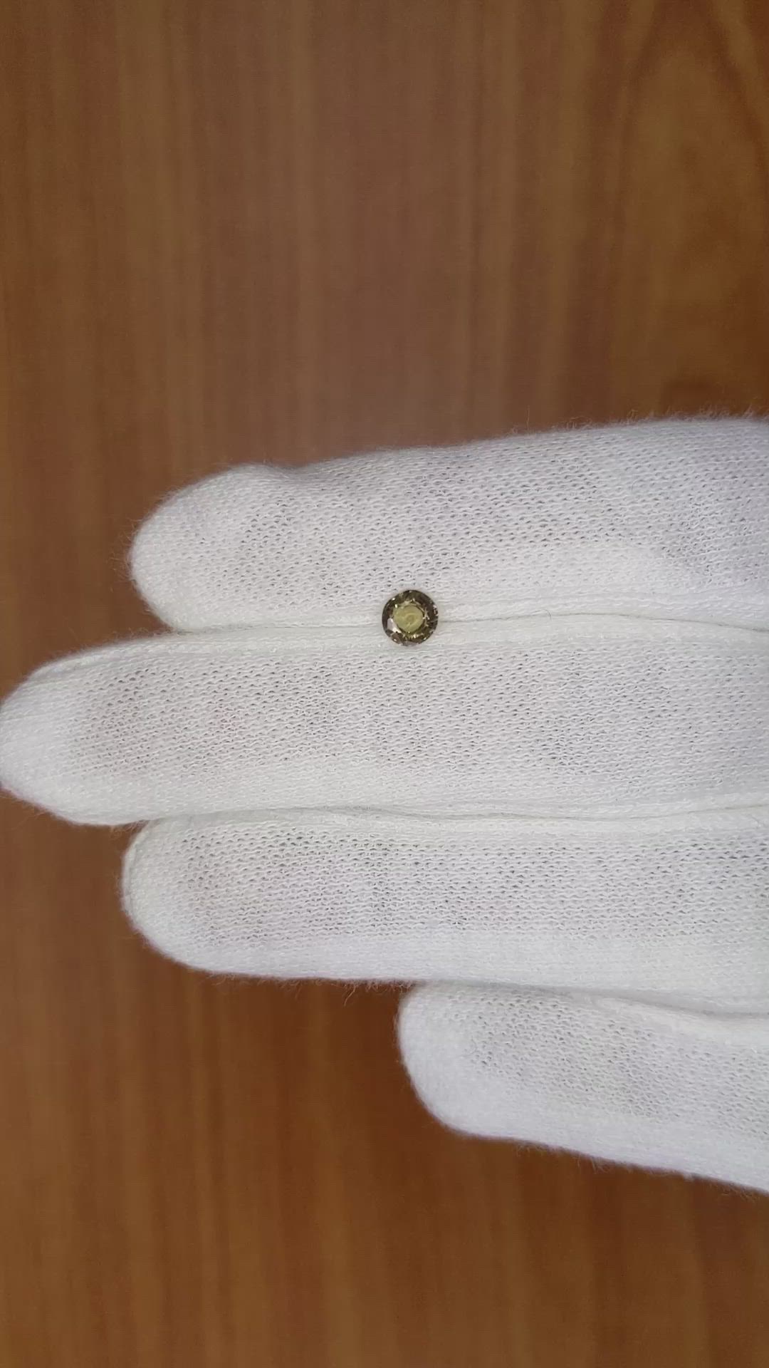 0.41 Ct. Greenish Brown Sapphire from Madagascar Size Video