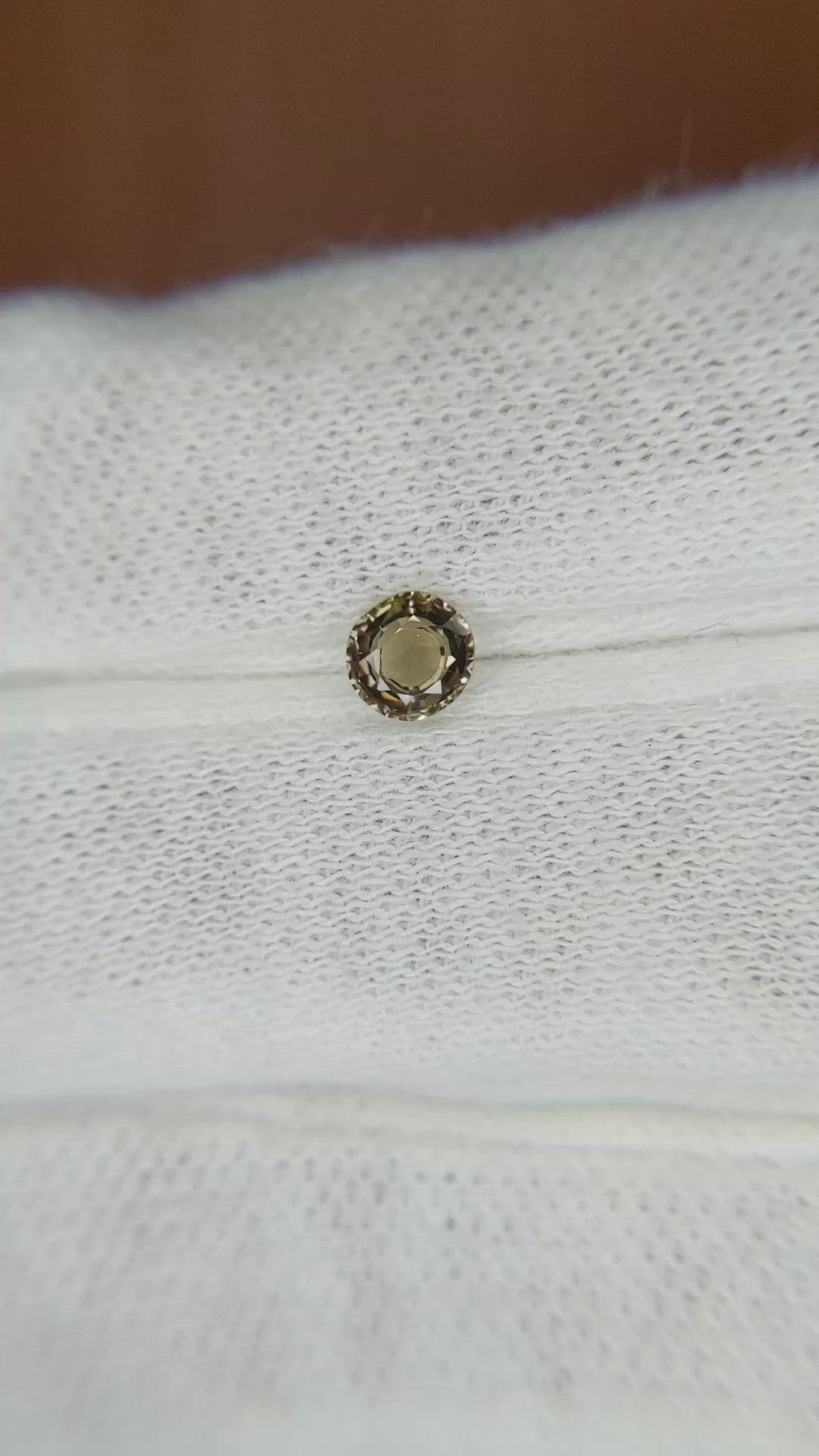0.41 Ct. Greenish Brown Sapphire from Madagascar Size Video