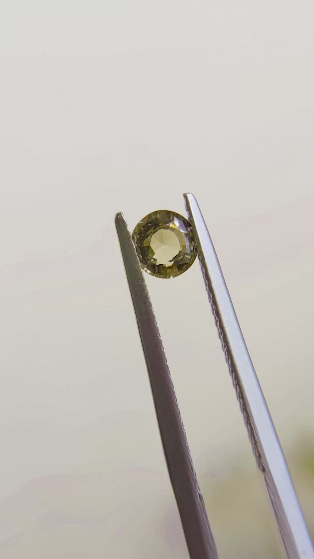 0.41 Ct. Greenish Brown Sapphire from Madagascar Size Video