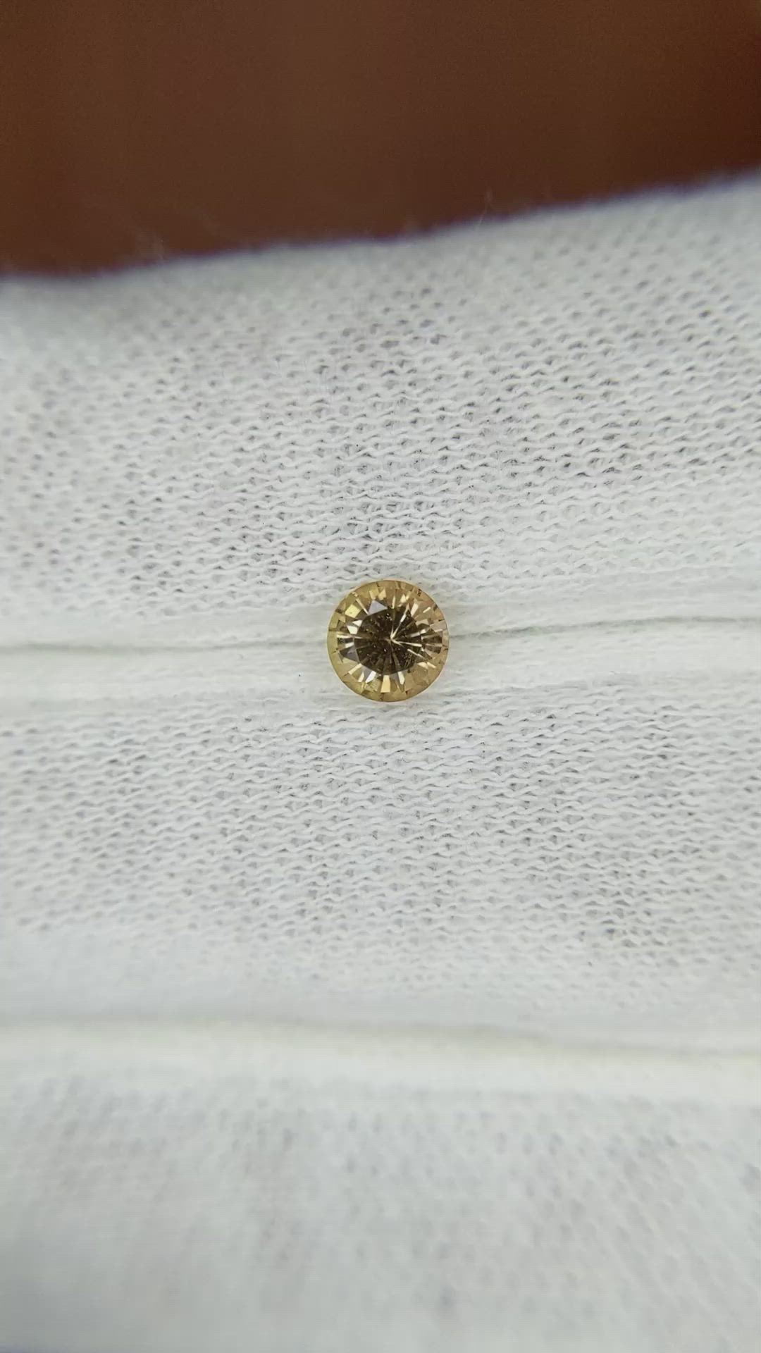 0.53 Ct. Yellowish Brown Sapphire from Madagascar Size Video