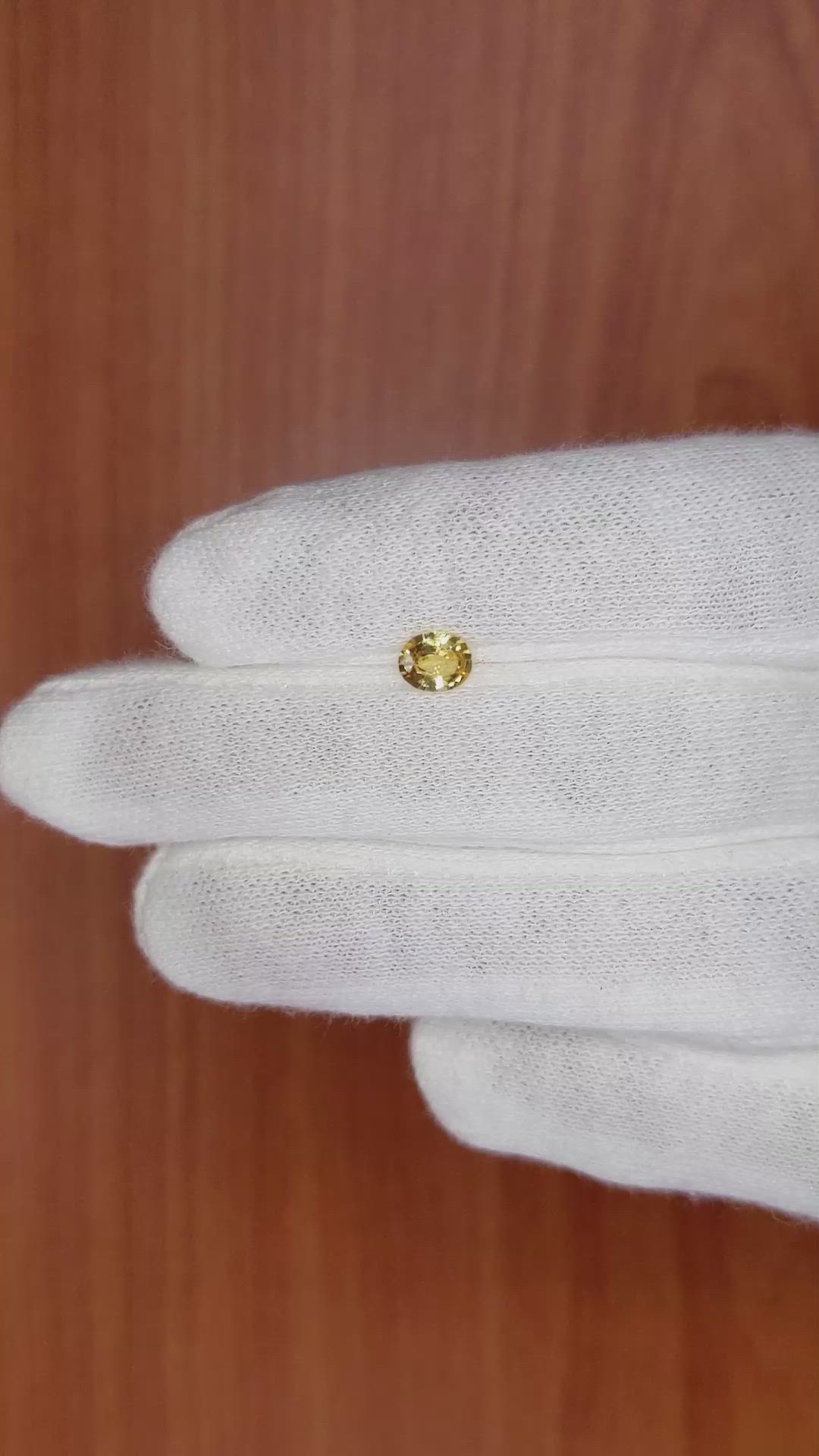 0.59 Ct. Orangish Yellow Sapphire from Madagascar Size Video