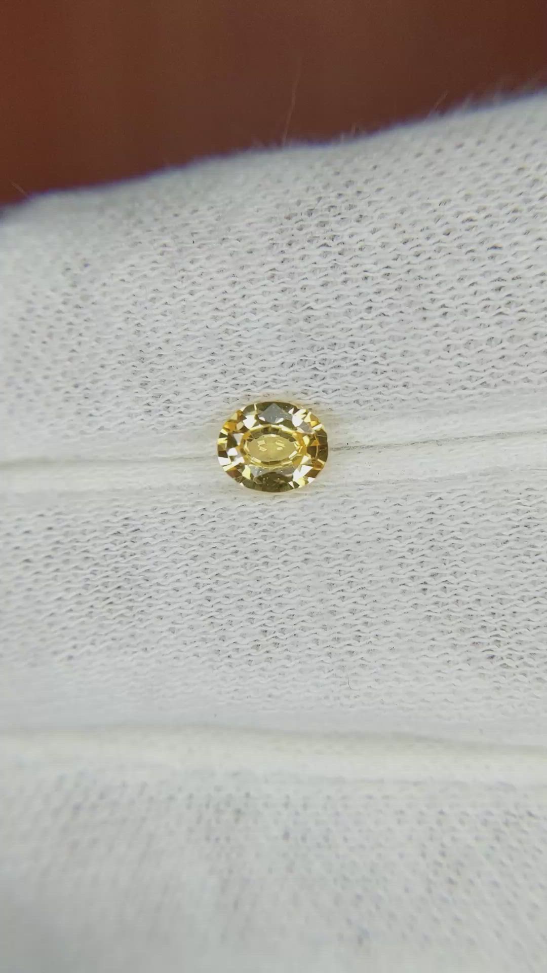 0.59 Ct. Orangish Yellow Sapphire from Madagascar Size Video