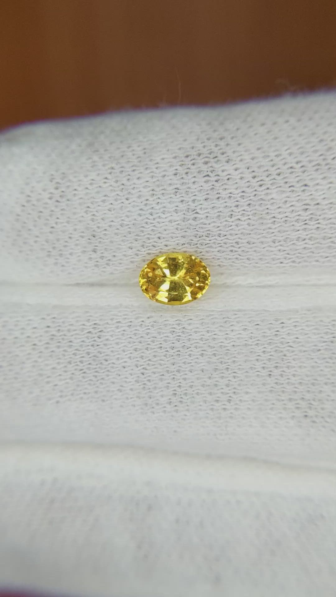 0.77 Ct. Orangish Yellow Sapphire from Madagascar Size Video