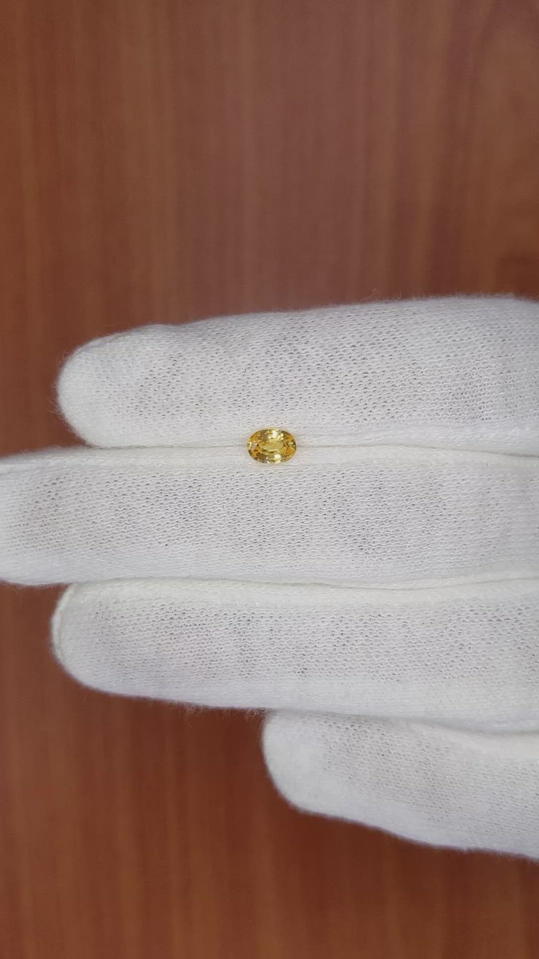 0.44 Ct. Orangish Yellow Sapphire from Madagascar Size Video
