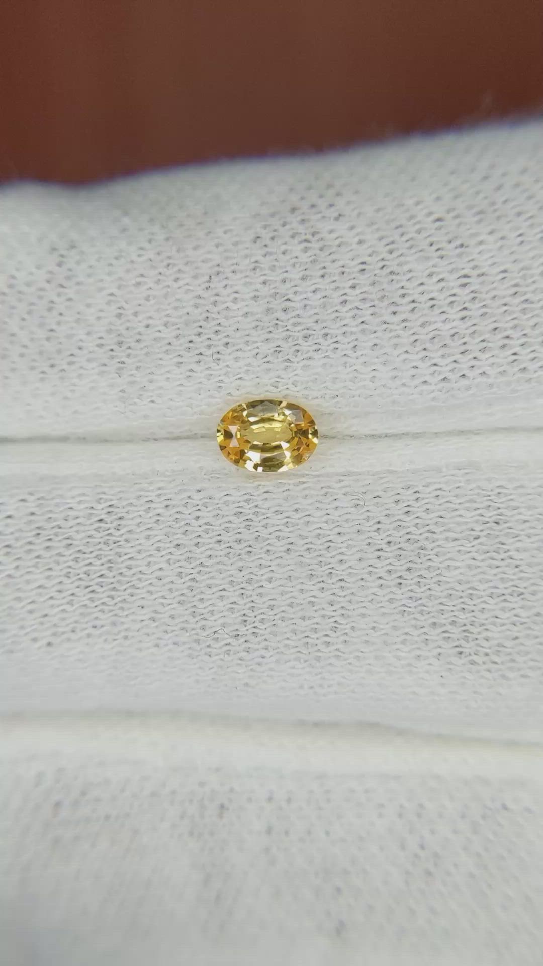 0.44 Ct. Orangish Yellow Sapphire from Madagascar Size Video