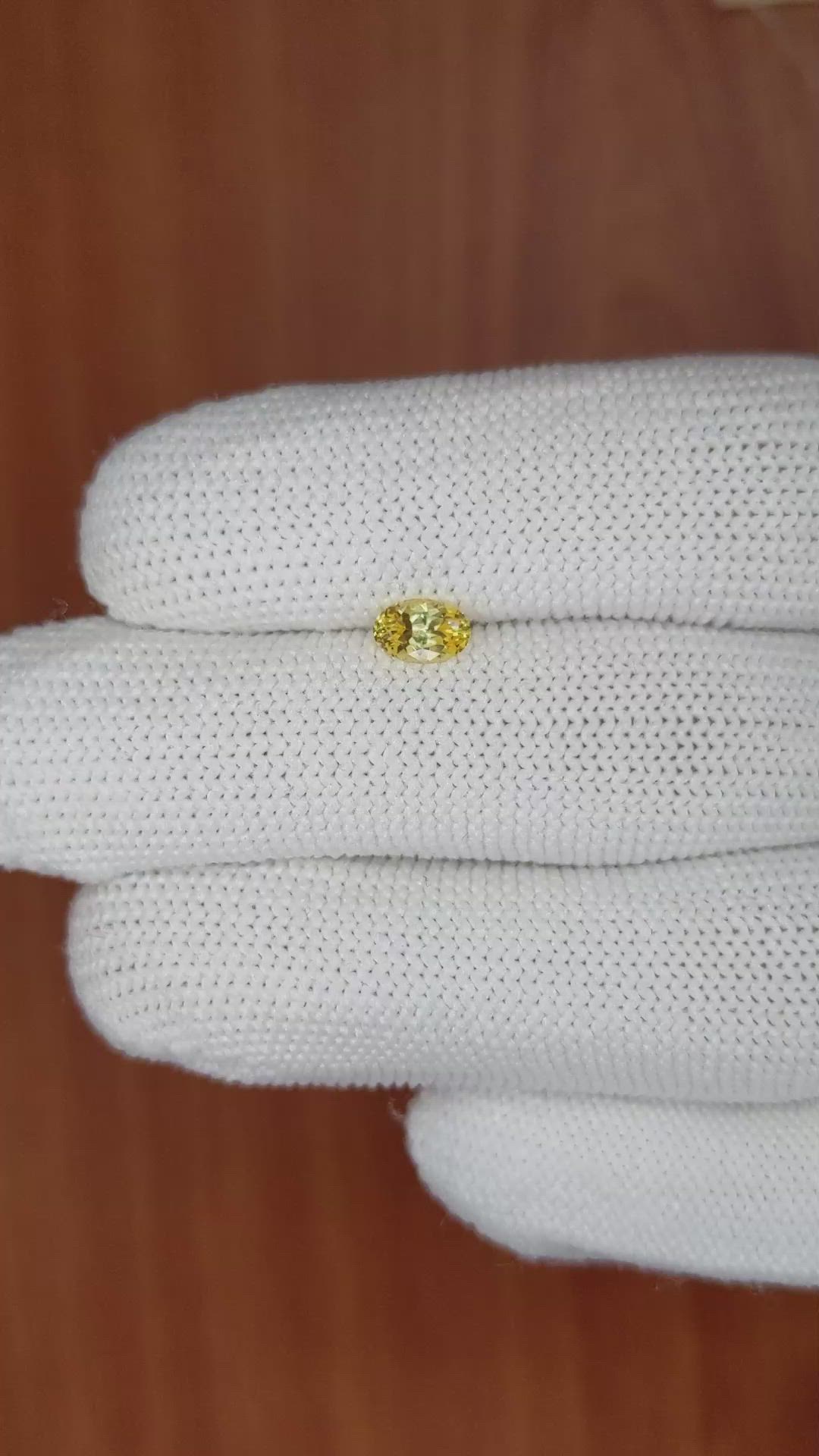 0.60 Ct. Orangish Yellow Sapphire from Ceylon (Sri Lanka) Size Video