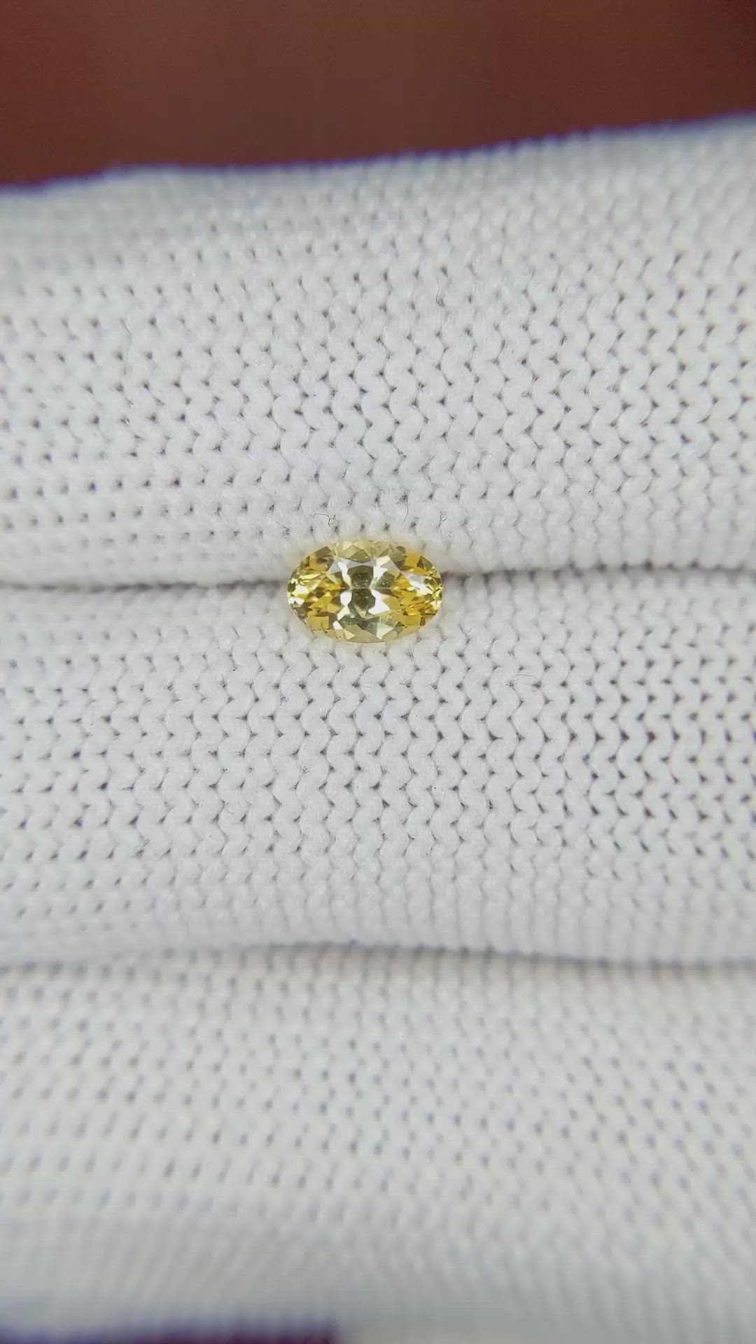 0.60 Ct. Orangish Yellow Sapphire from Ceylon (Sri Lanka) Size Video