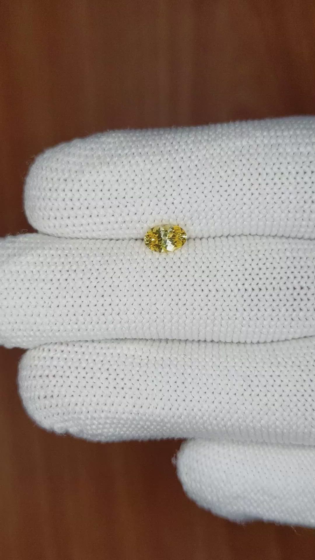 0.56 Ct. Orangish Yellow Sapphire from Ceylon (Sri Lanka) Size Video