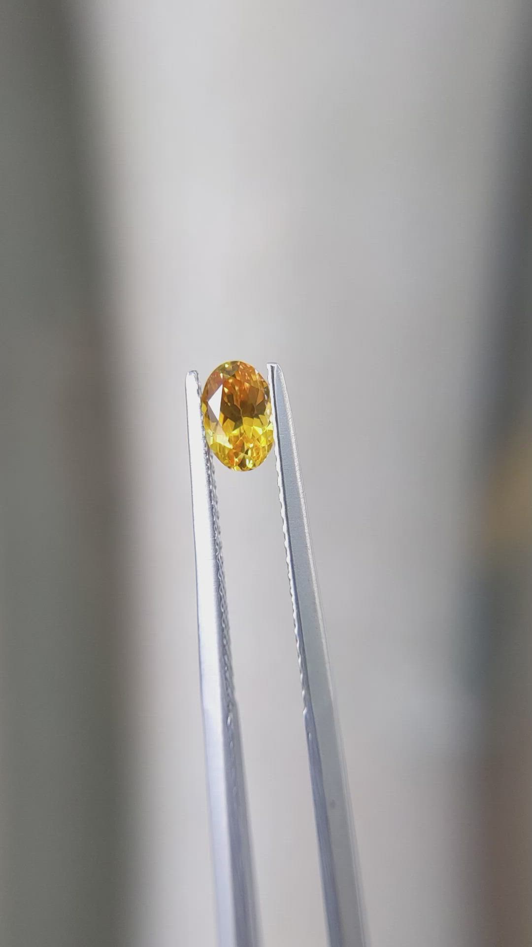 0.56 Ct. Yellowish Orange Sapphire from Ceylon (Sri Lanka) Size Video