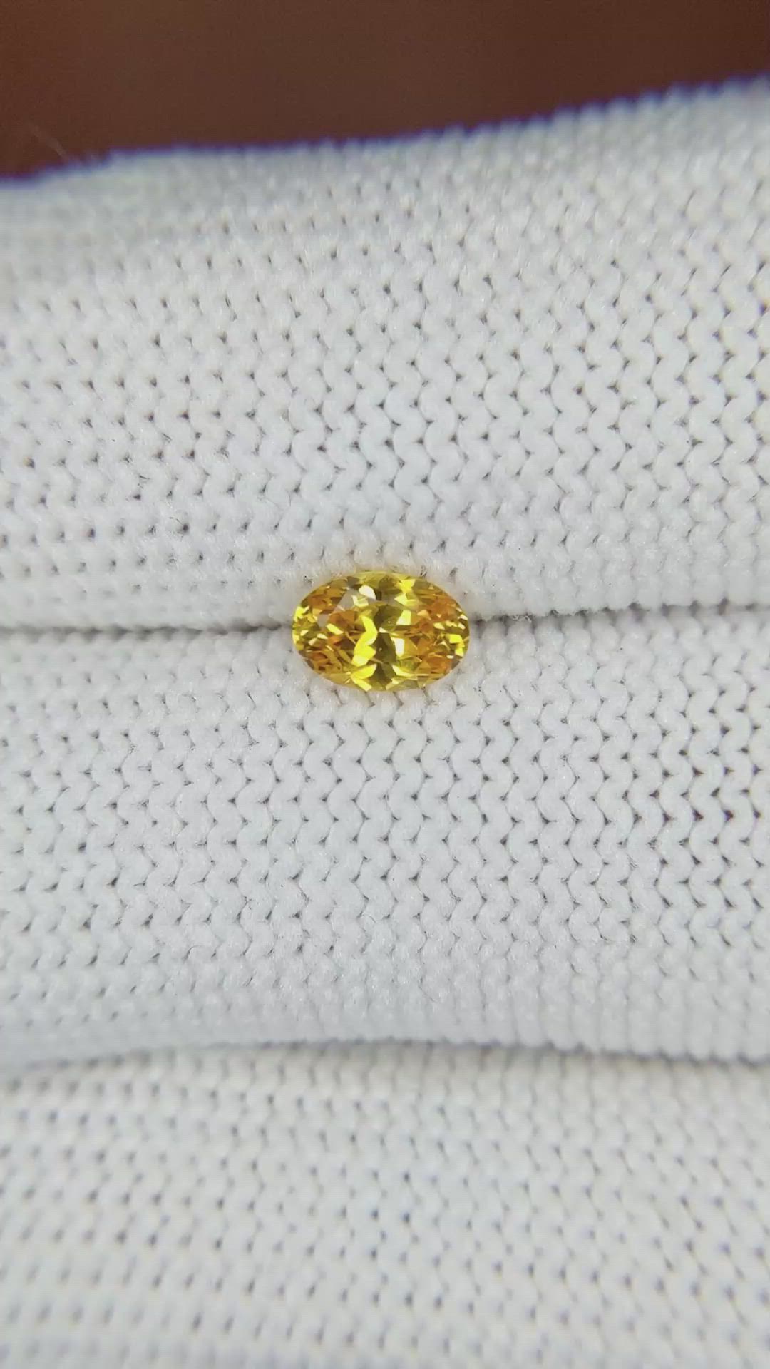 0.61 Ct. Orangish Yellow Sapphire from Ceylon (Sri Lanka) Size Video