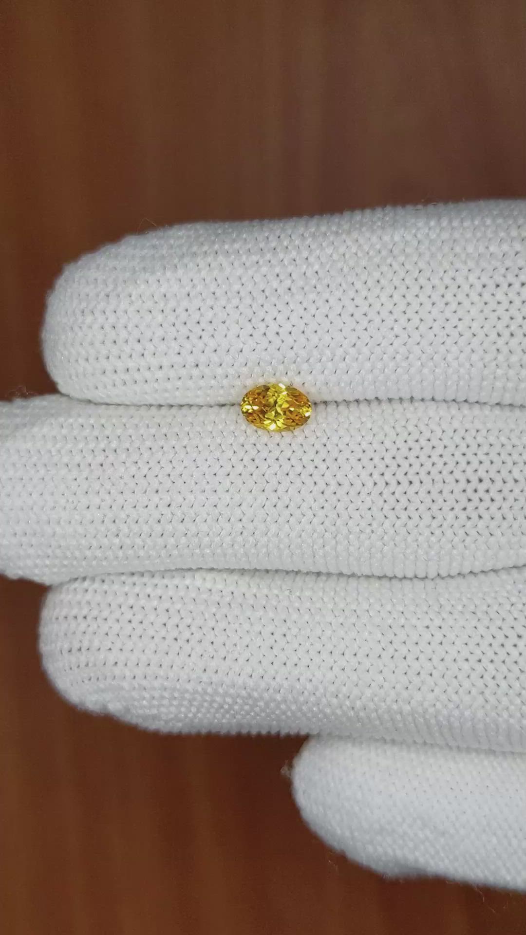 0.61 Ct. Orangish Yellow Sapphire from Ceylon (Sri Lanka) Size Video