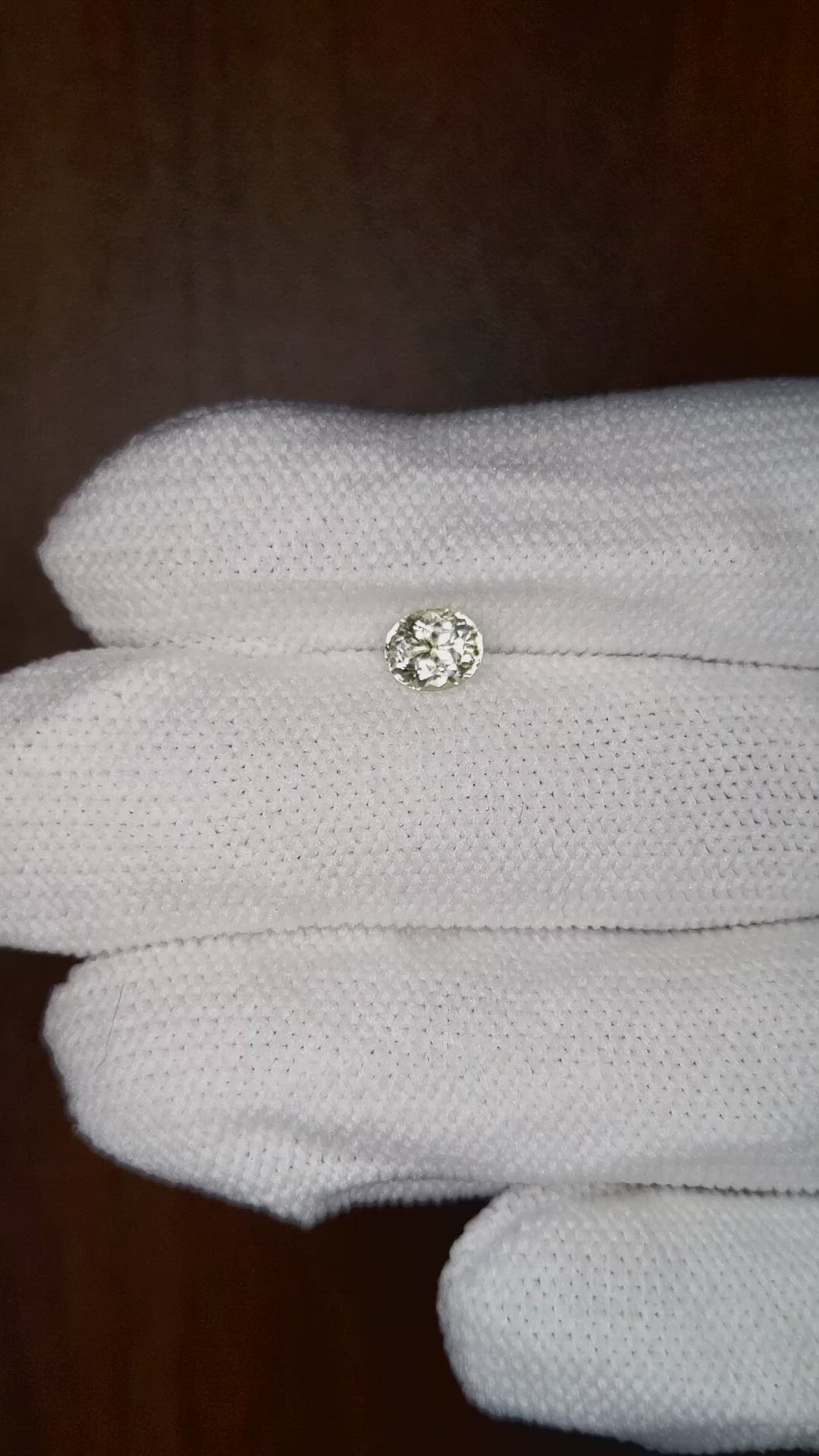 0.88 Ct. Greenish Yellow Sapphire from Montana Size Video