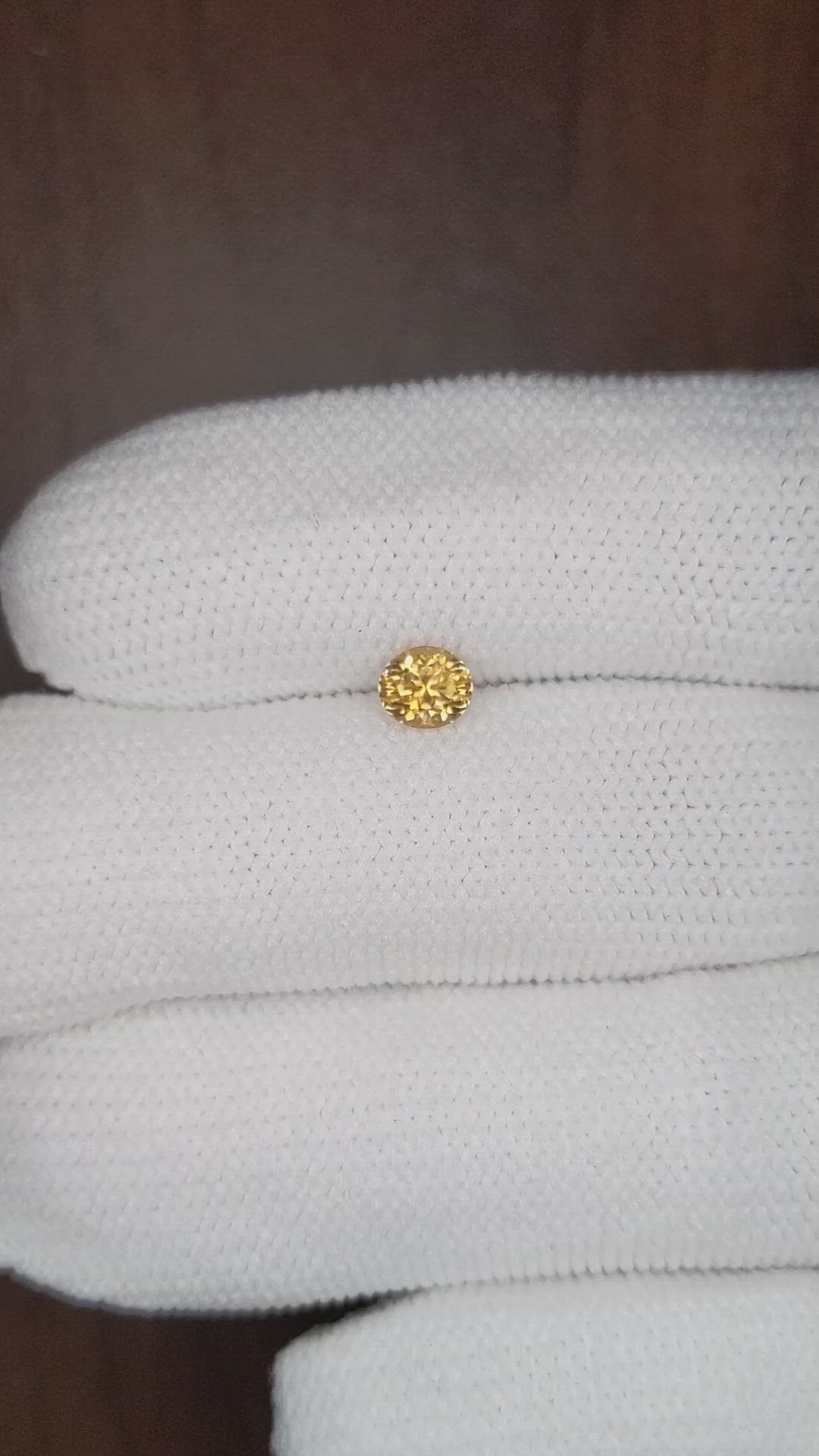 0.57 Ct. Yellowish Orange Sapphire from Montana Size Video