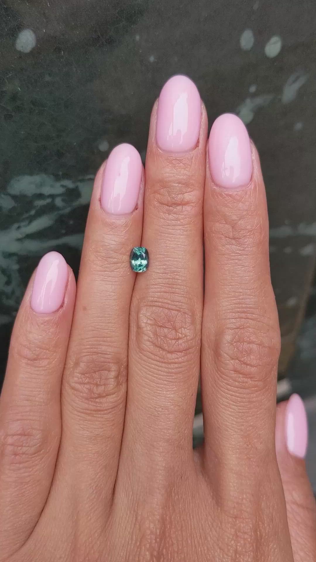 0.66 Ct. Bluish Green Sapphire from Montana Size Video
