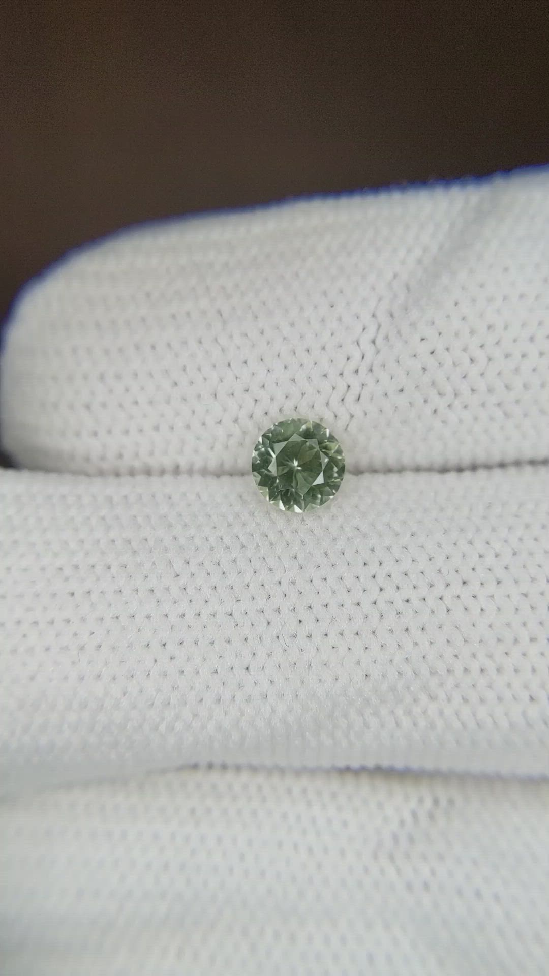 0.59 Ct. Yellowish Green Sapphire from Montana Size Video