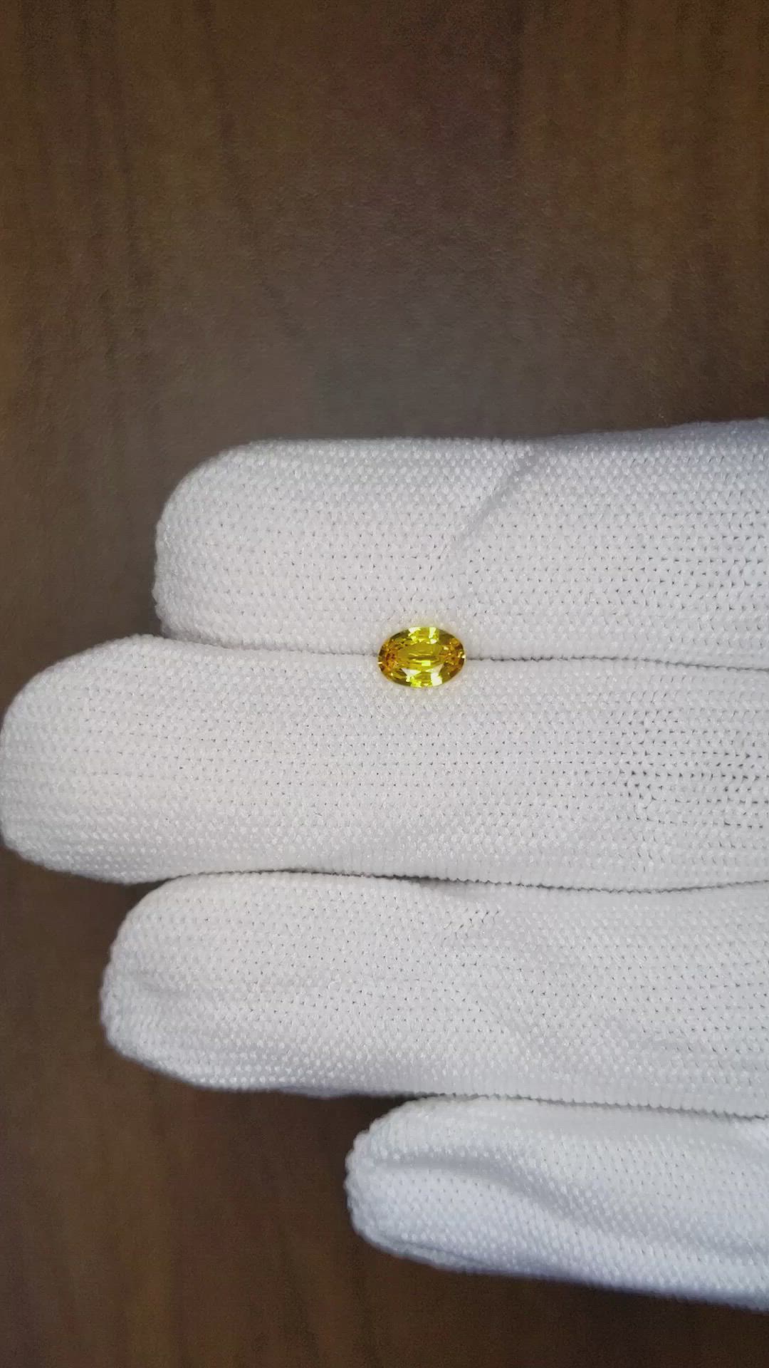 0.61 Ct. Yellowish Orange Sapphire from Ceylon (Sri Lanka) Size Video