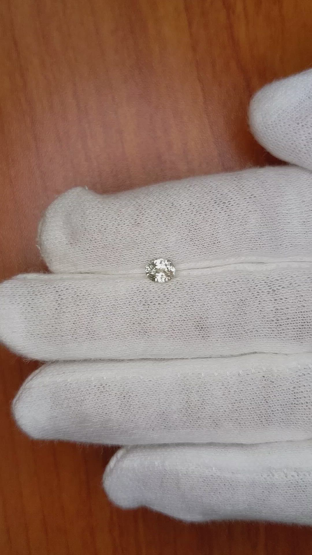 0.65 Ct. Peach Sapphire from Ceylon (Sri Lanka) Size Video
