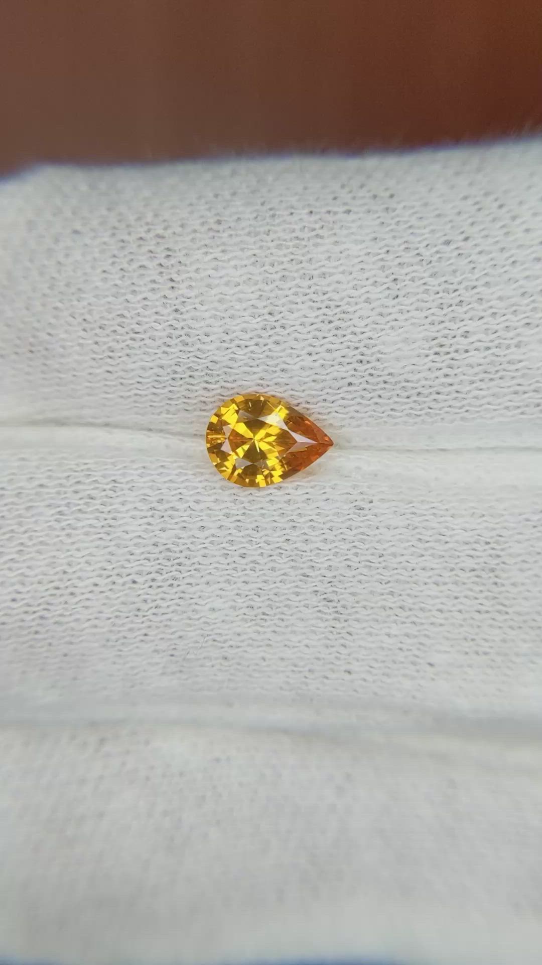 0.74 Ct. Orange Sapphire from Ceylon (Sri Lanka) Size Video