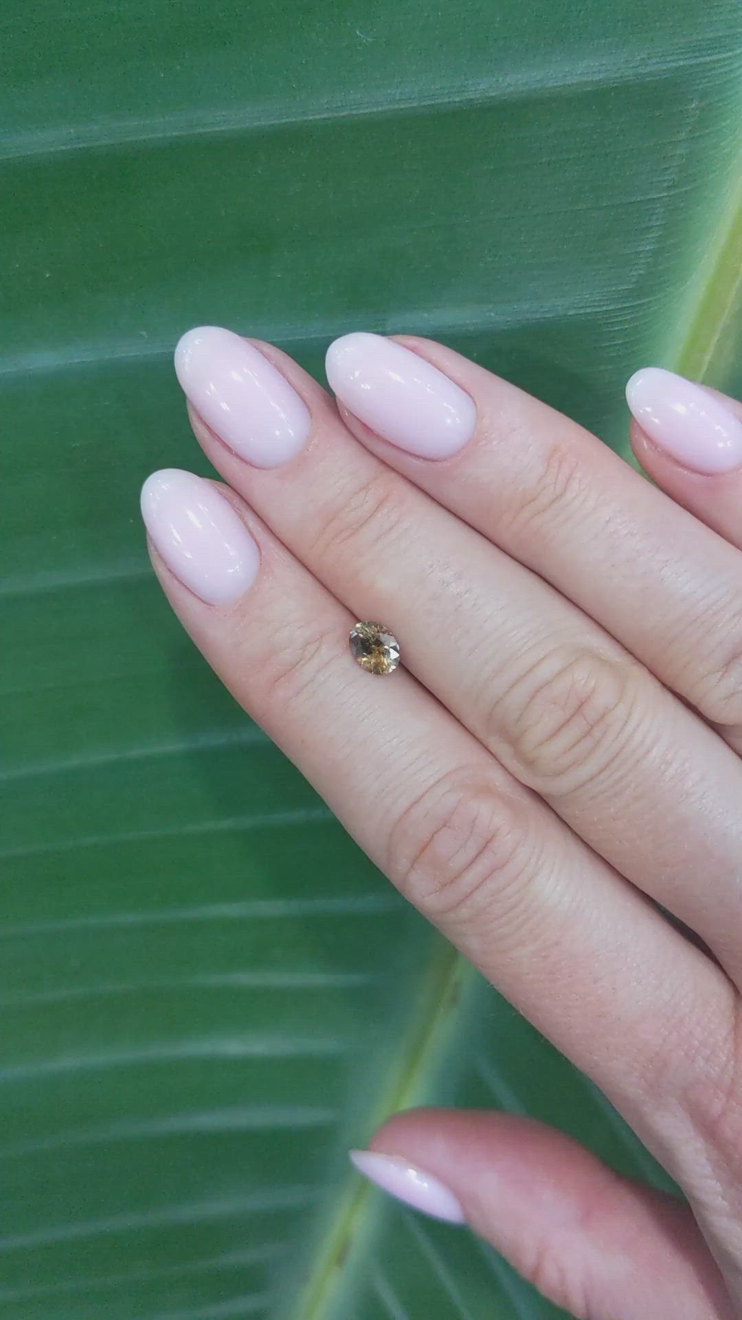 0.64 Ct. Orangish Brown Sapphire from Montana Size Video