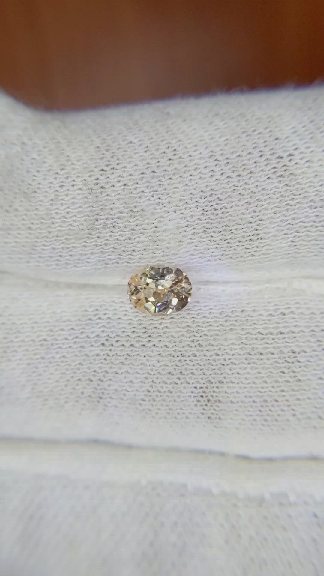 0.69 Ct. Peach Sapphire from Ceylon (Sri Lanka) Size Video